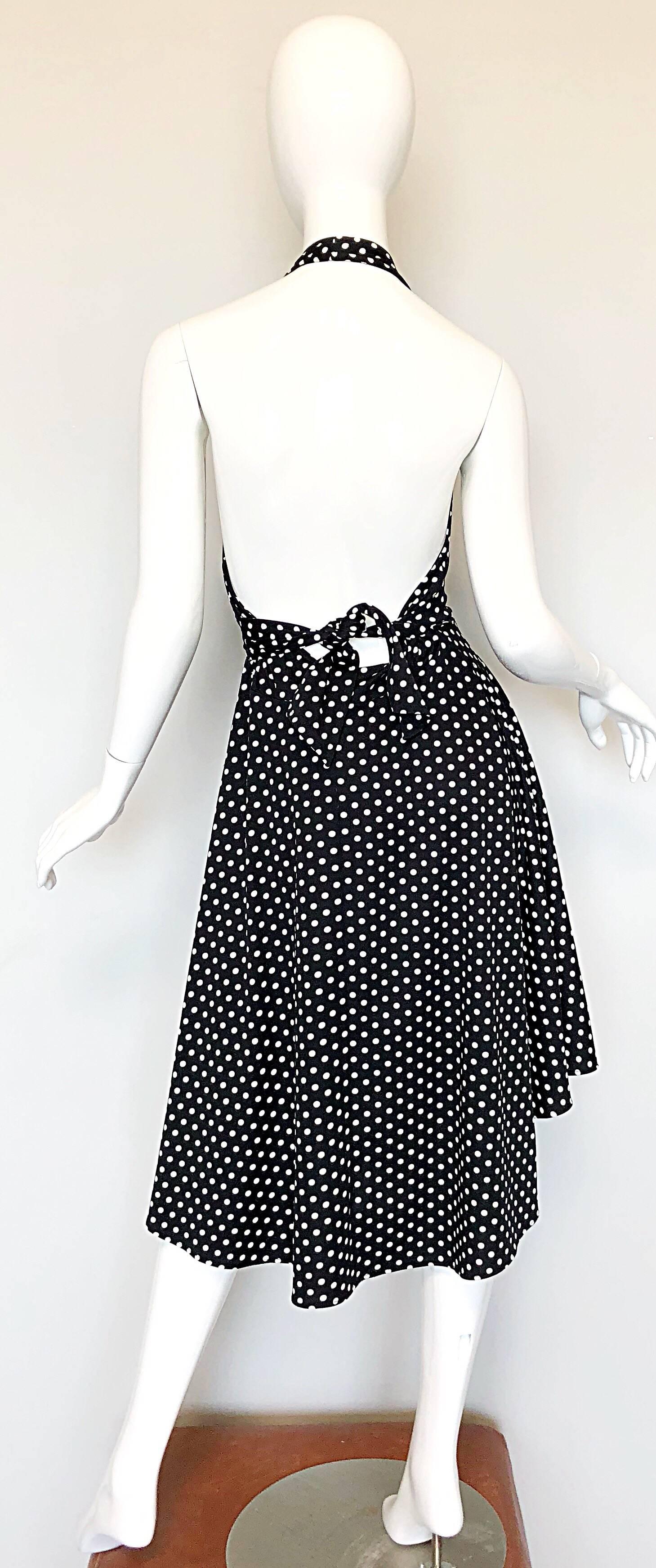 Sexy 70s FREDERICK'S OF HOLLYWOOD black and white polka dot jersey halter dress! Channel your inner Marilyn Monroe in this beauty! Features a tie back with a peekaboo detail. Asymmetrical handkerchief hemline dips in the front. Can easily work for