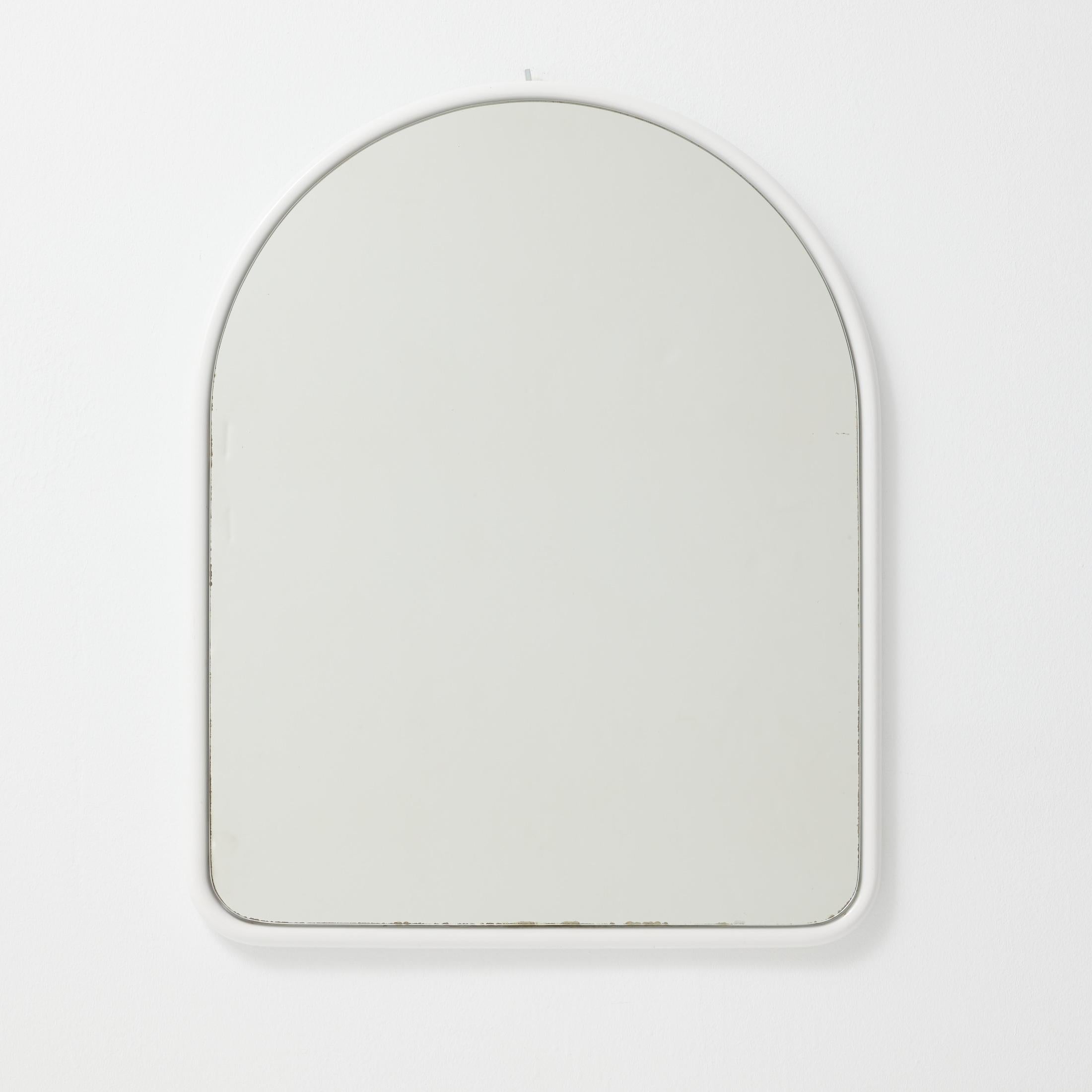 A sleek and timeless French arched wall mirror from the 1970s, featuring a clean white metal frame and a graceful curved silhouette. This piece blends functionality with a subtle sculptural presence, evoking both mid-century simplicity and the