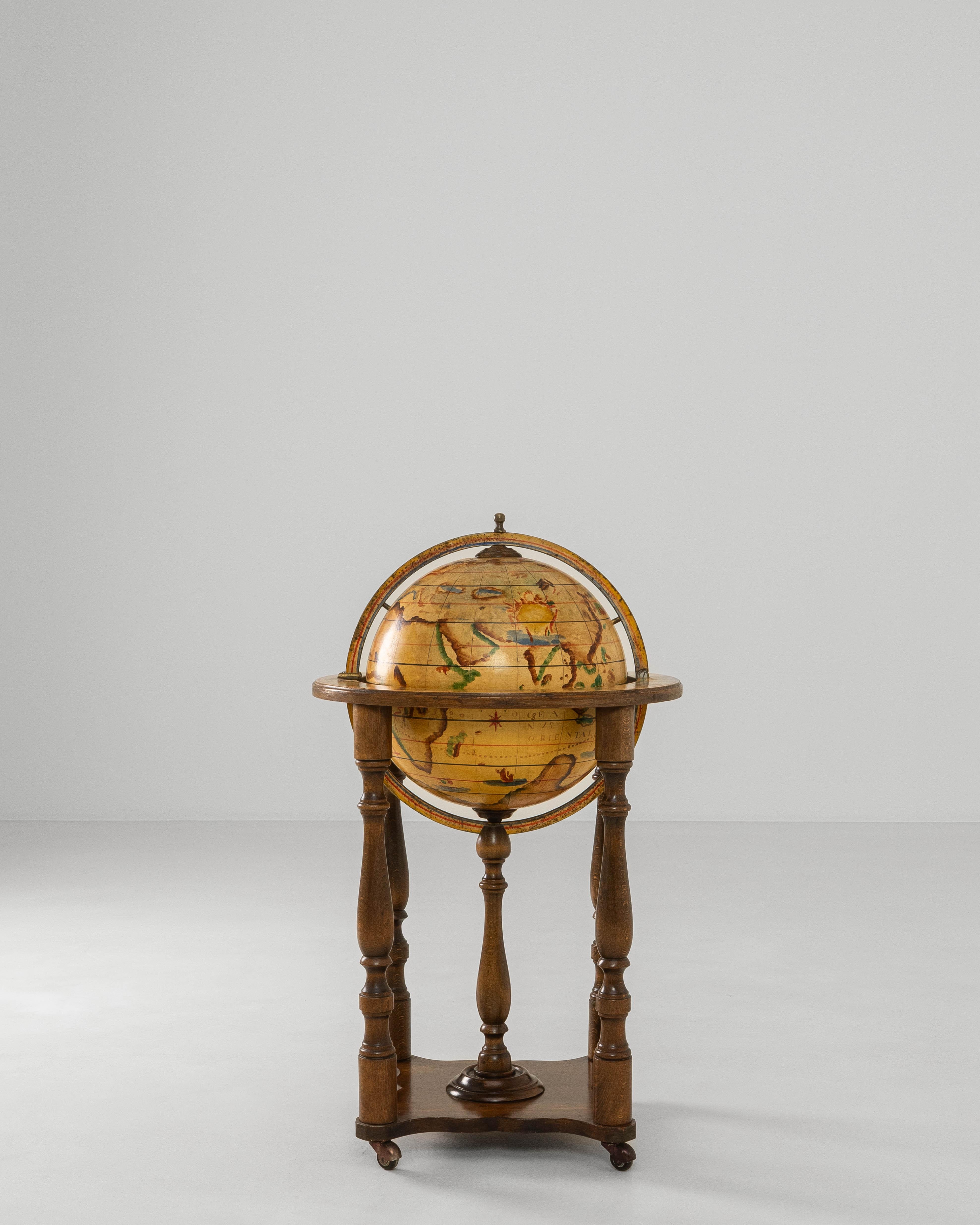 This 1970s French Baroque style globe bar cart combines decorative flair with playful functionality, serving as both a statement piece and a conversation starter. Crafted with a richly toned wooden stand, the design features turned legs, carved