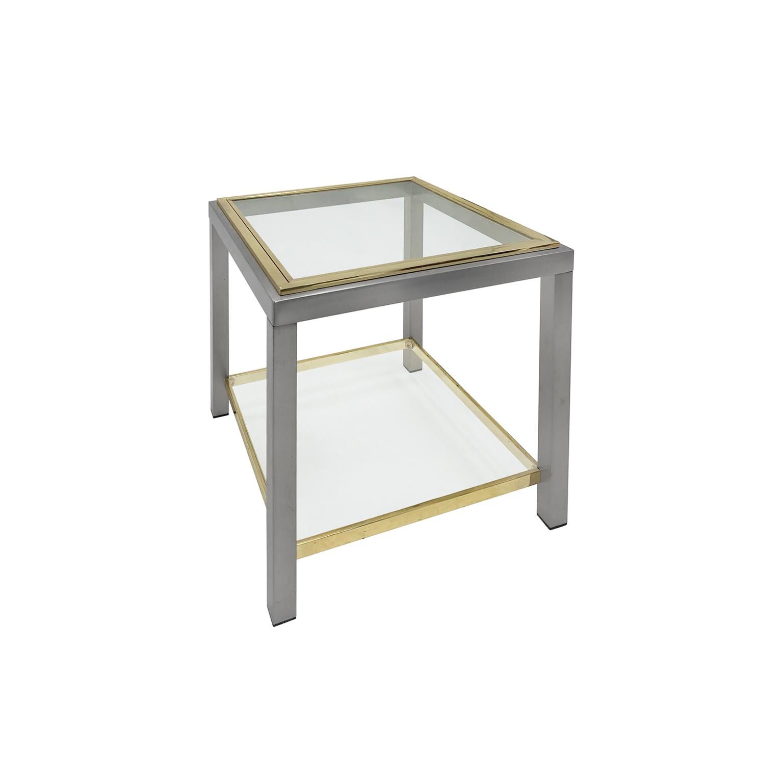 Brass and chrome two-tiered side table by Romeo Rega. France, 1970s. 

Pair available, priced individually.