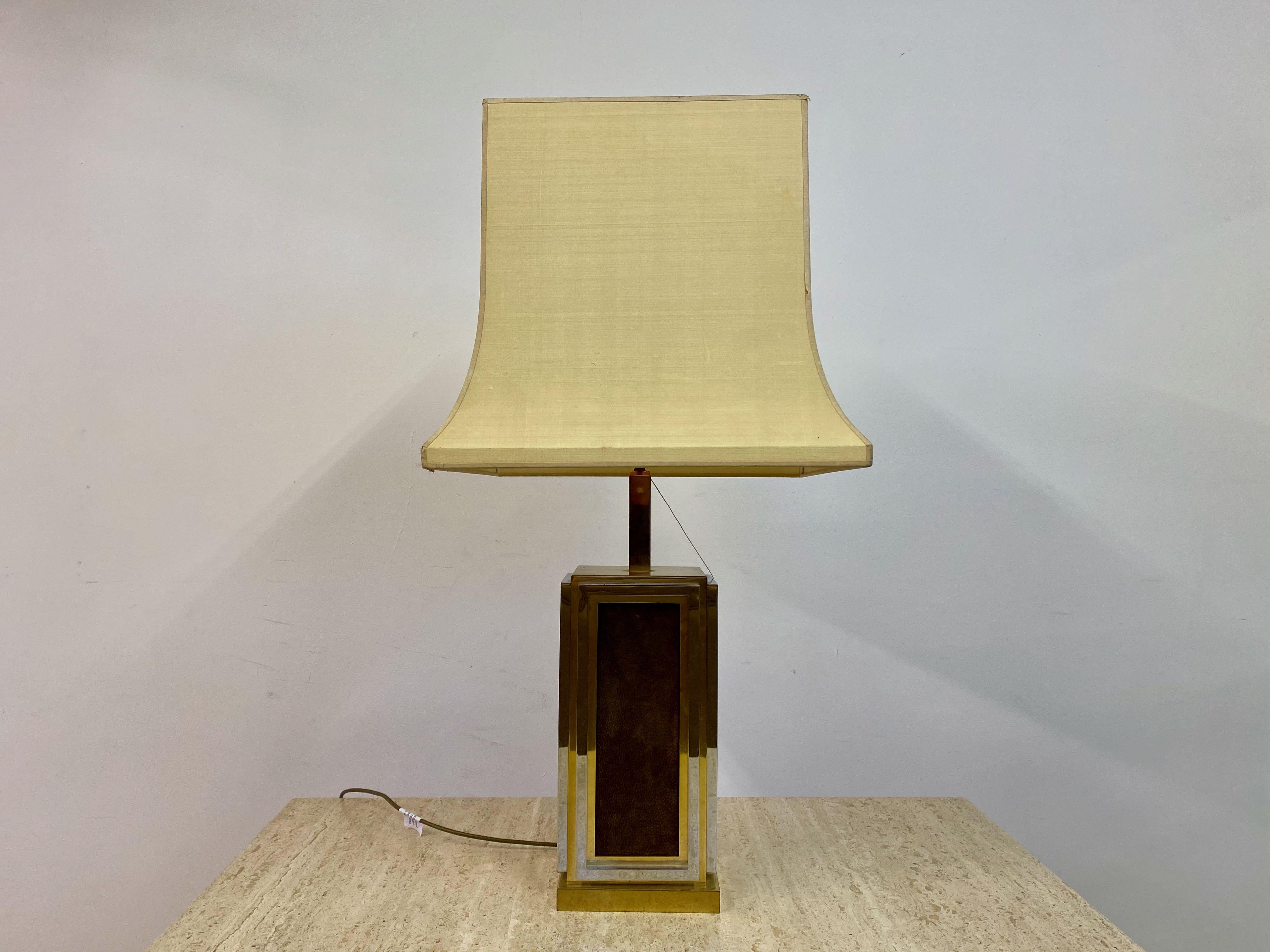 Table lamp 

By Maison Jansen

Brass, chrome and leather

France 1970s

Lamp base measures: 15 x 17 cm.