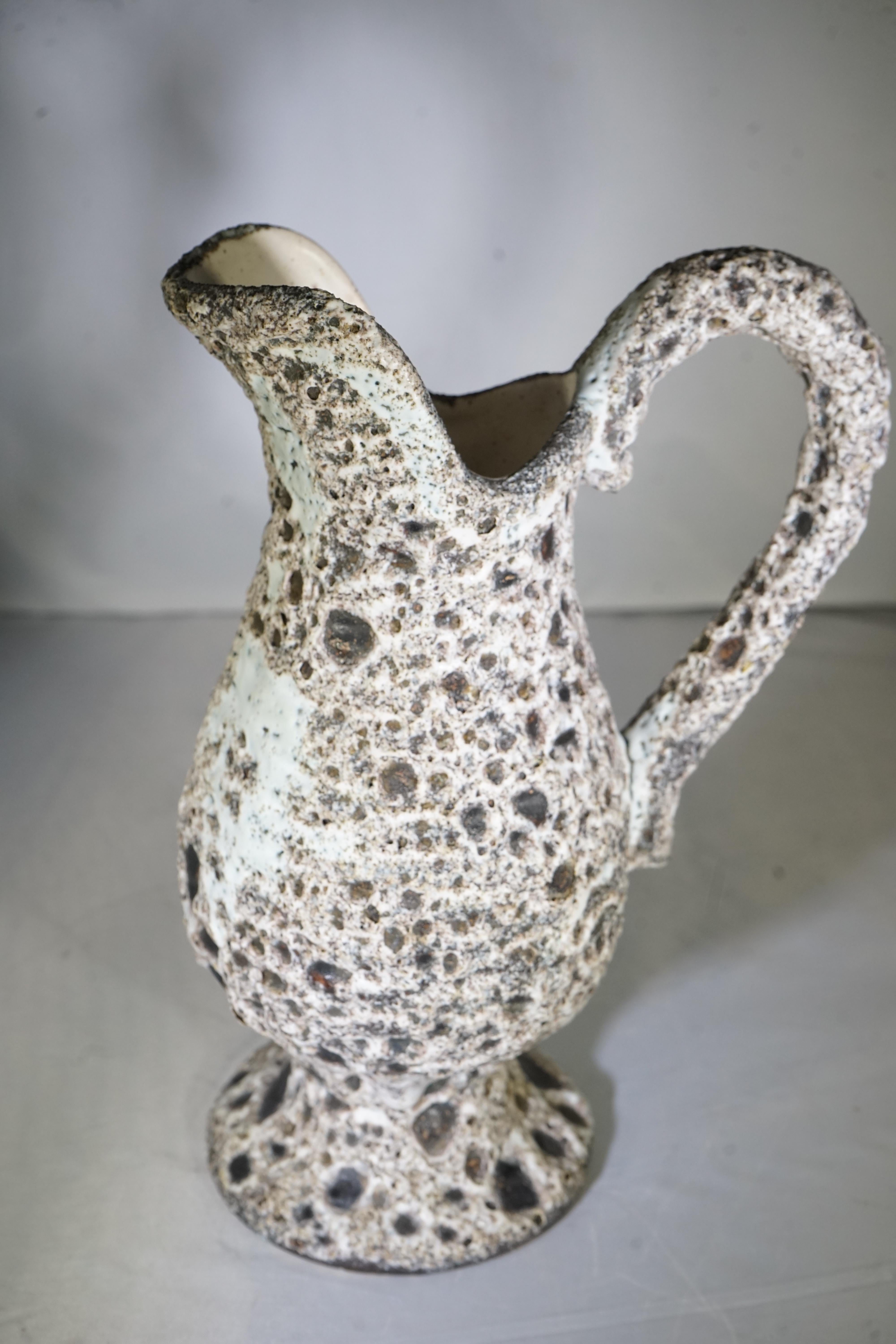 1970s French ceramic pottery vase with volcanic design and handle.