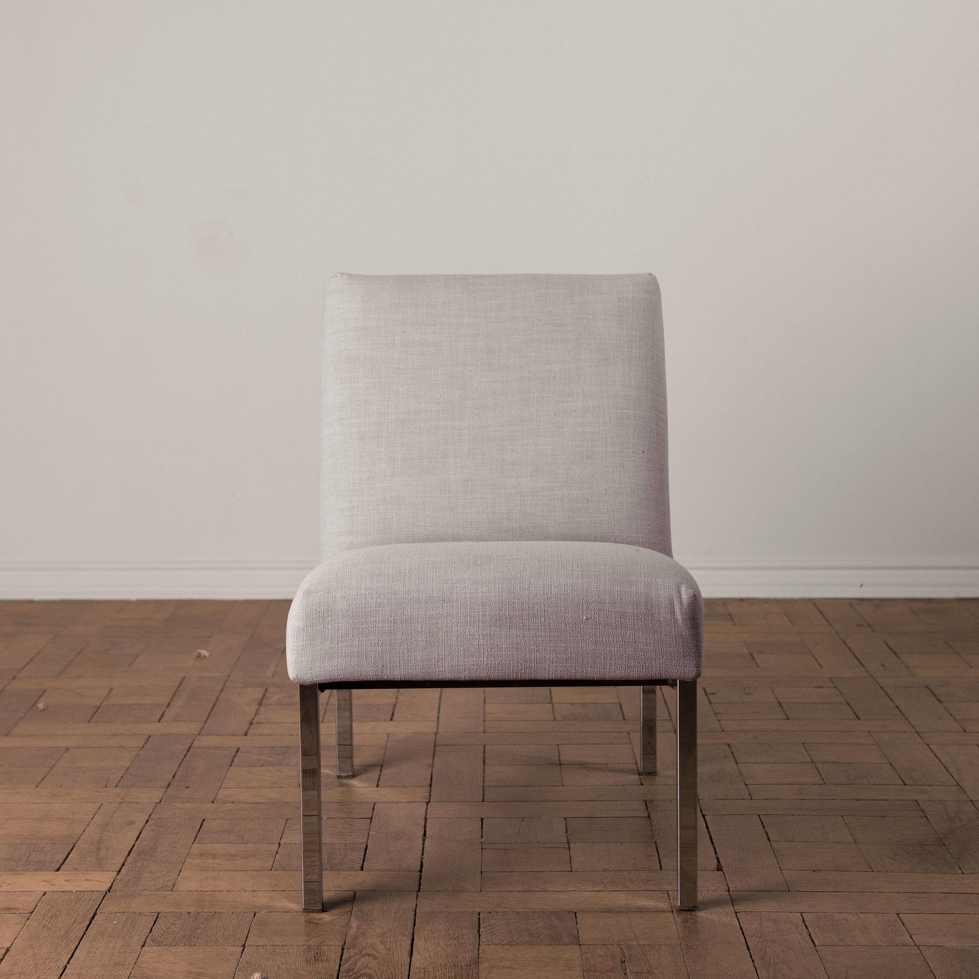 Upholstered chair with metal frame, a sleek design from circa 1970. In typical period style geometric forms combine for a composed and stylish effect. Reupholstered in a cotton-linen blend, four available.