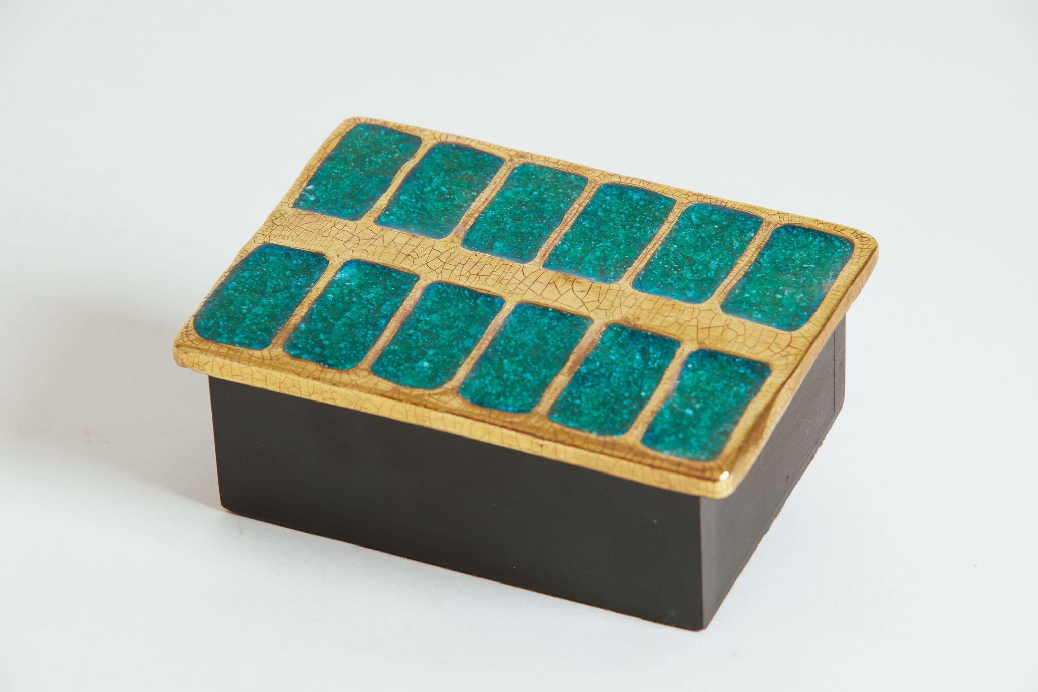 1970s French Francois Lembo box with green glass inlay and gold borders.