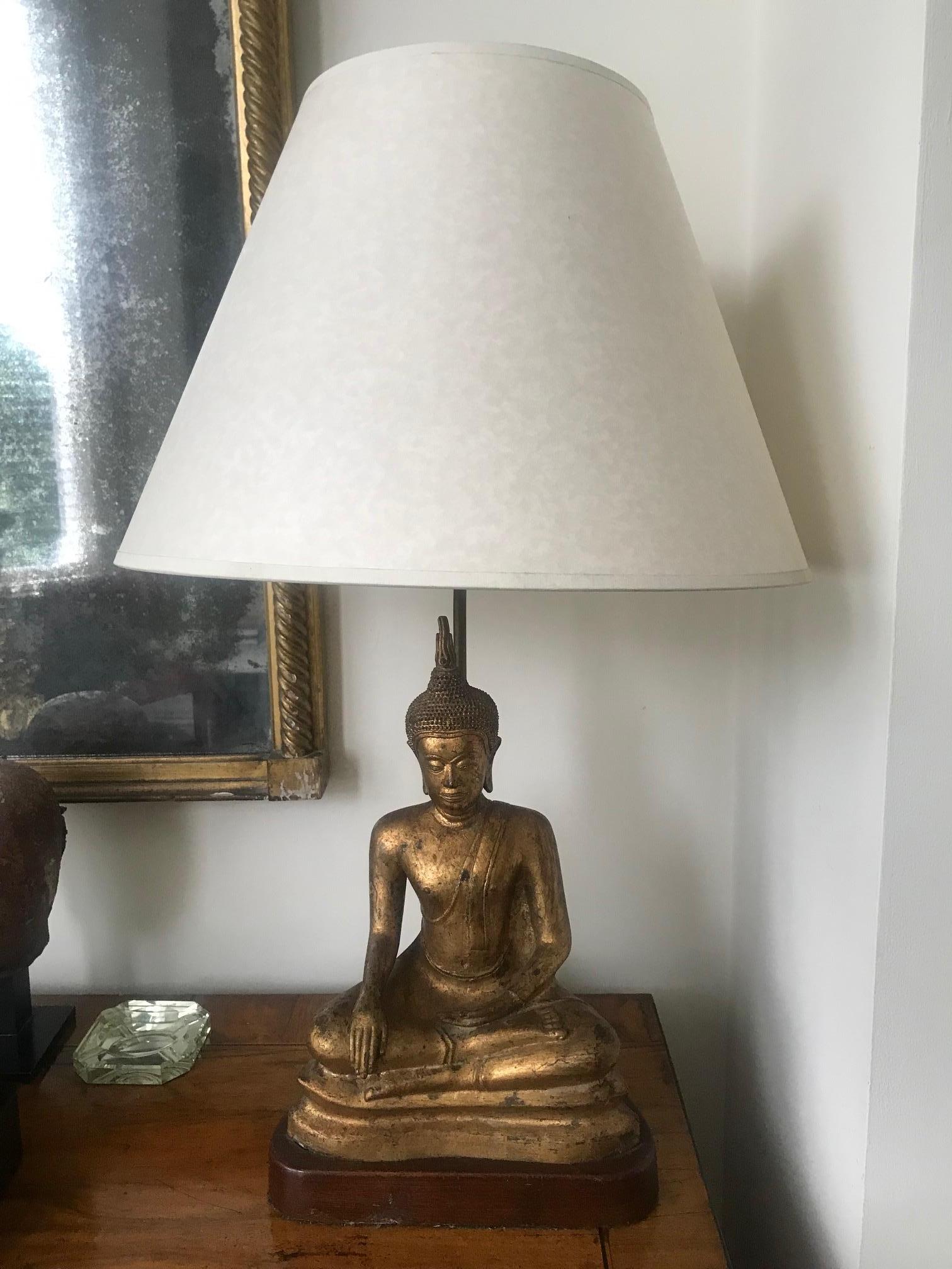 A wonderful French 1970s gilded metal lamp in the form of a seated Buddha, wonderful color and detail.