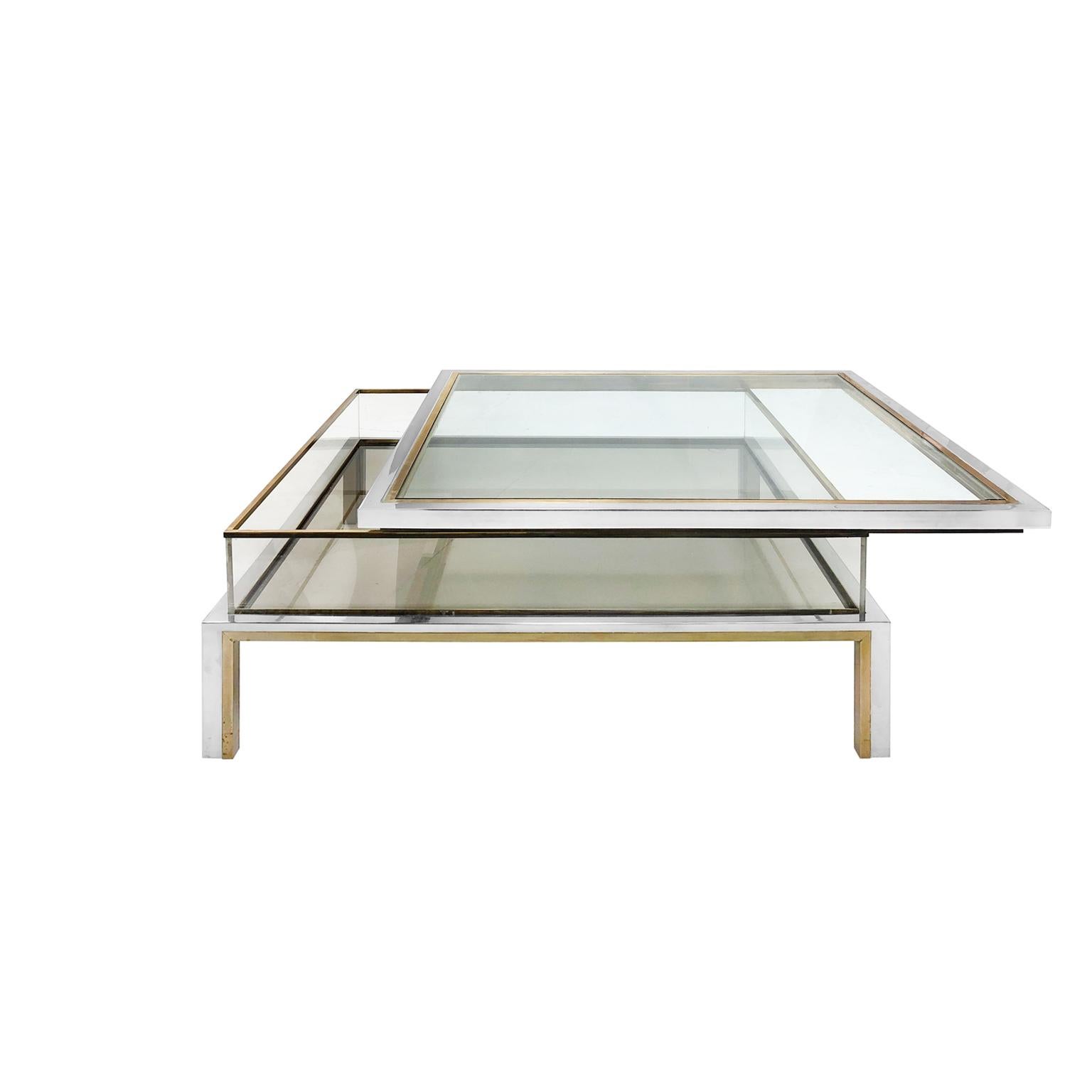 Square vitrine storage coffee table with glass sliding top, Lucite walls, and brass and chrome accenting by Maison Jansen. France, 1970s.