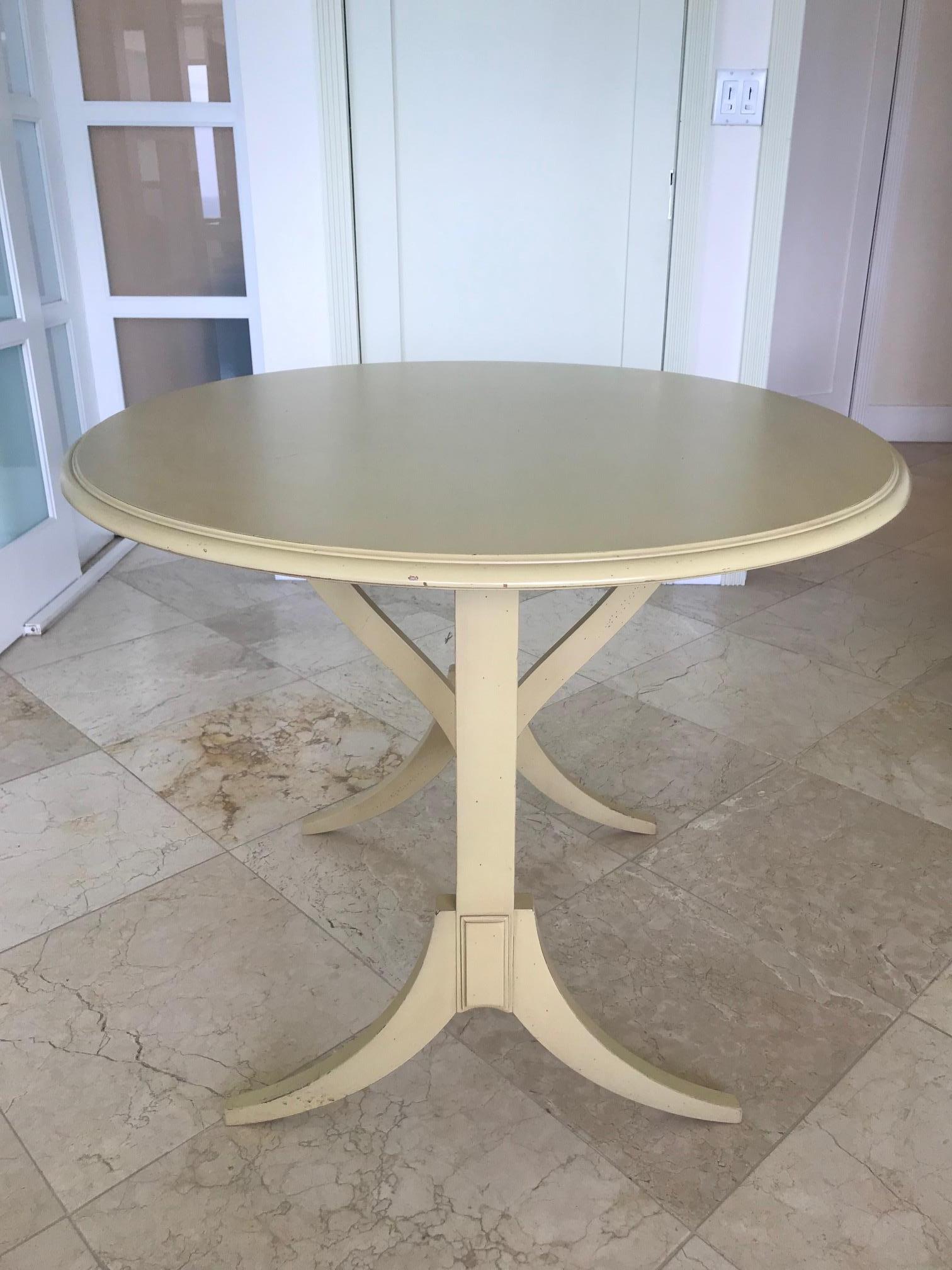 Gustavian style dessert table or library table in hand painted oakwood. Elegant hand carved designs throughout, the table features a large circular top with tilt function, for when it's not in use. The table has gorgeous splayed legs and is fitted