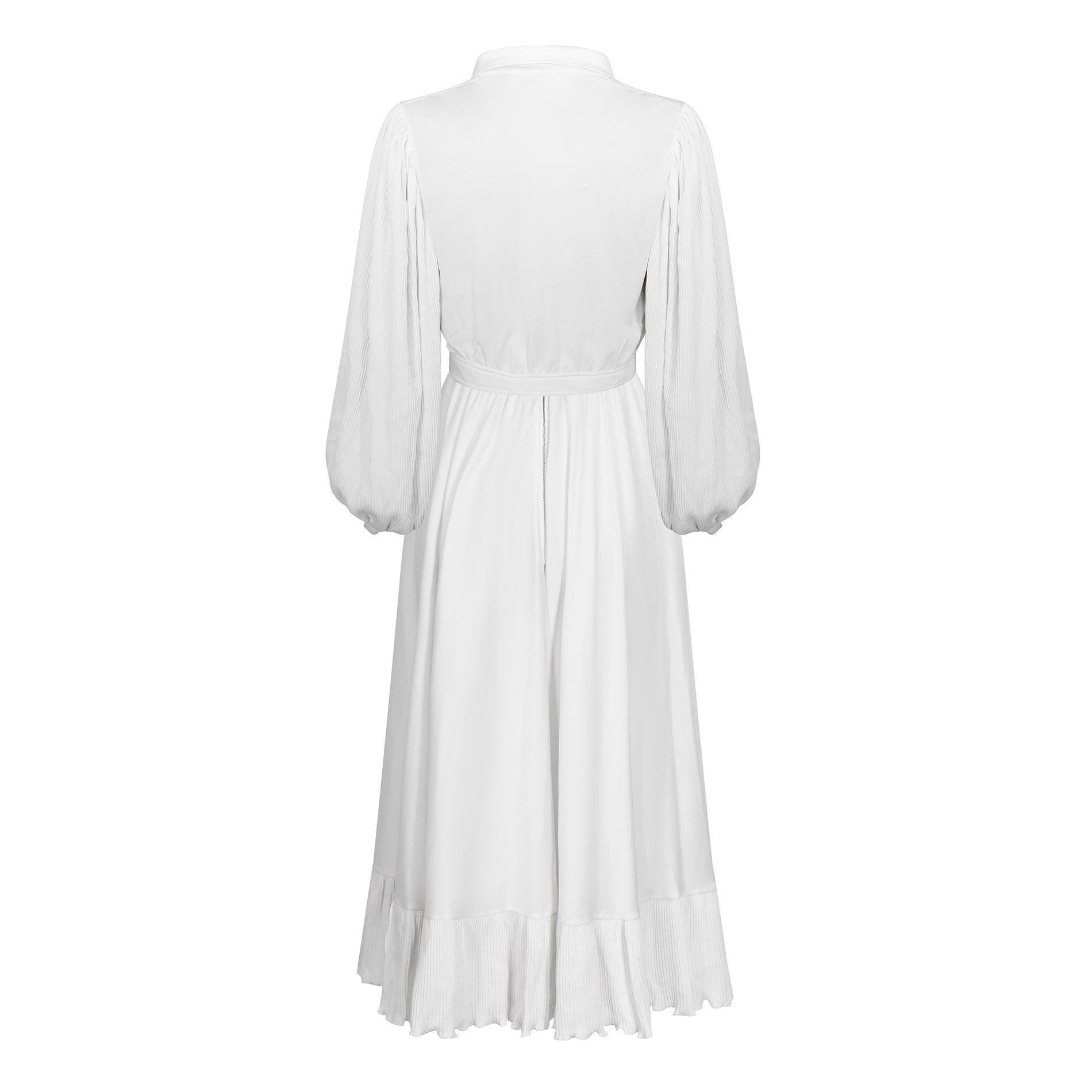 This is exceptional 1970s haute couture and a Parisienne take on the Studio 54 vibe that heavily influenced evening wear styles of the period. This jersey dress and jacket set is without its label but was entirely handmade in France. It is