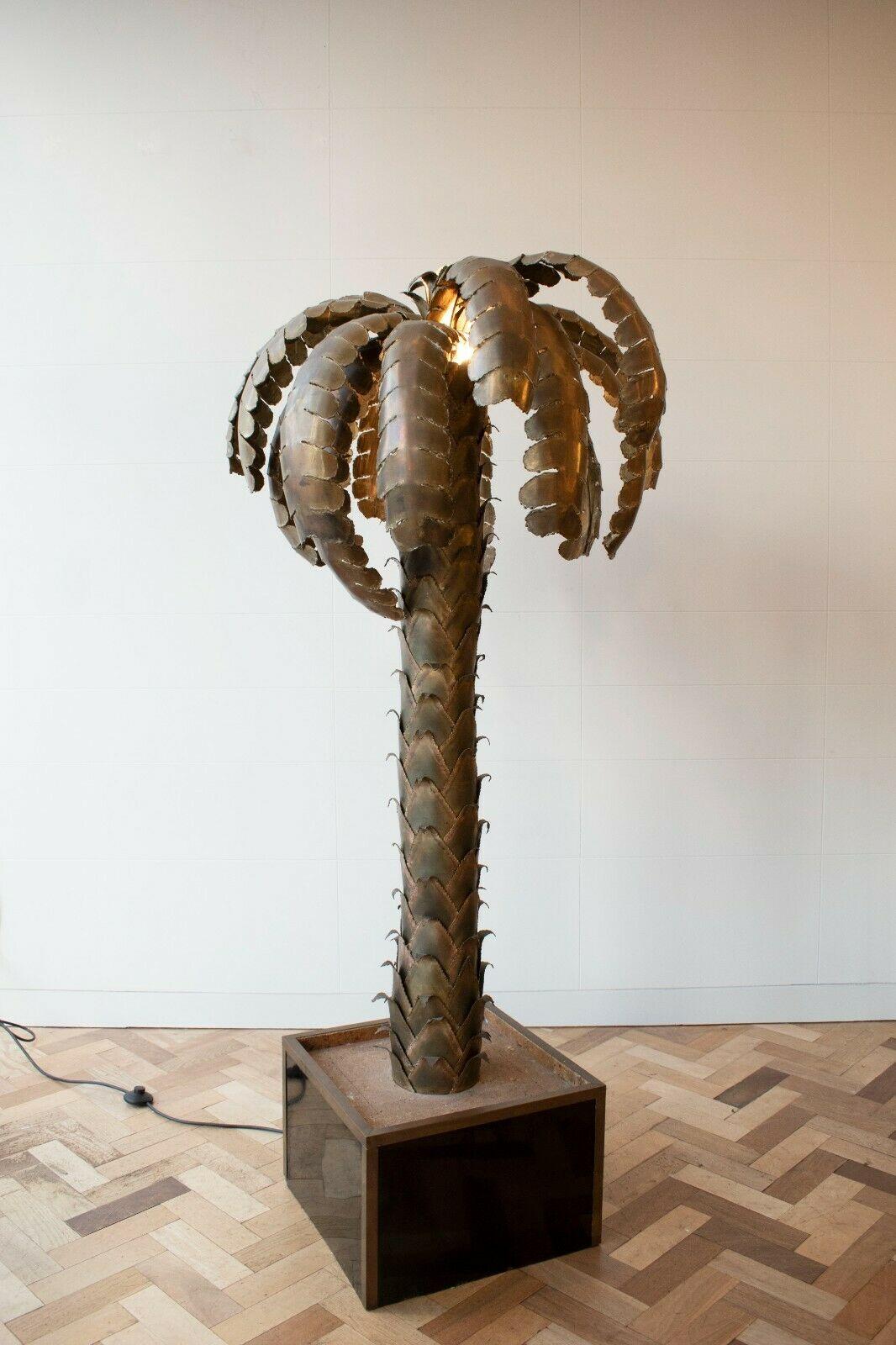 A very rare and unique 1970's Hollywood Regency style brass palm tree floor lamp designed by Maison Jansen in France. 

With 10 bulbs nestled within the leaves, combined with the effect of brass, a beautiful atmospheric lighting is achieved - an eye