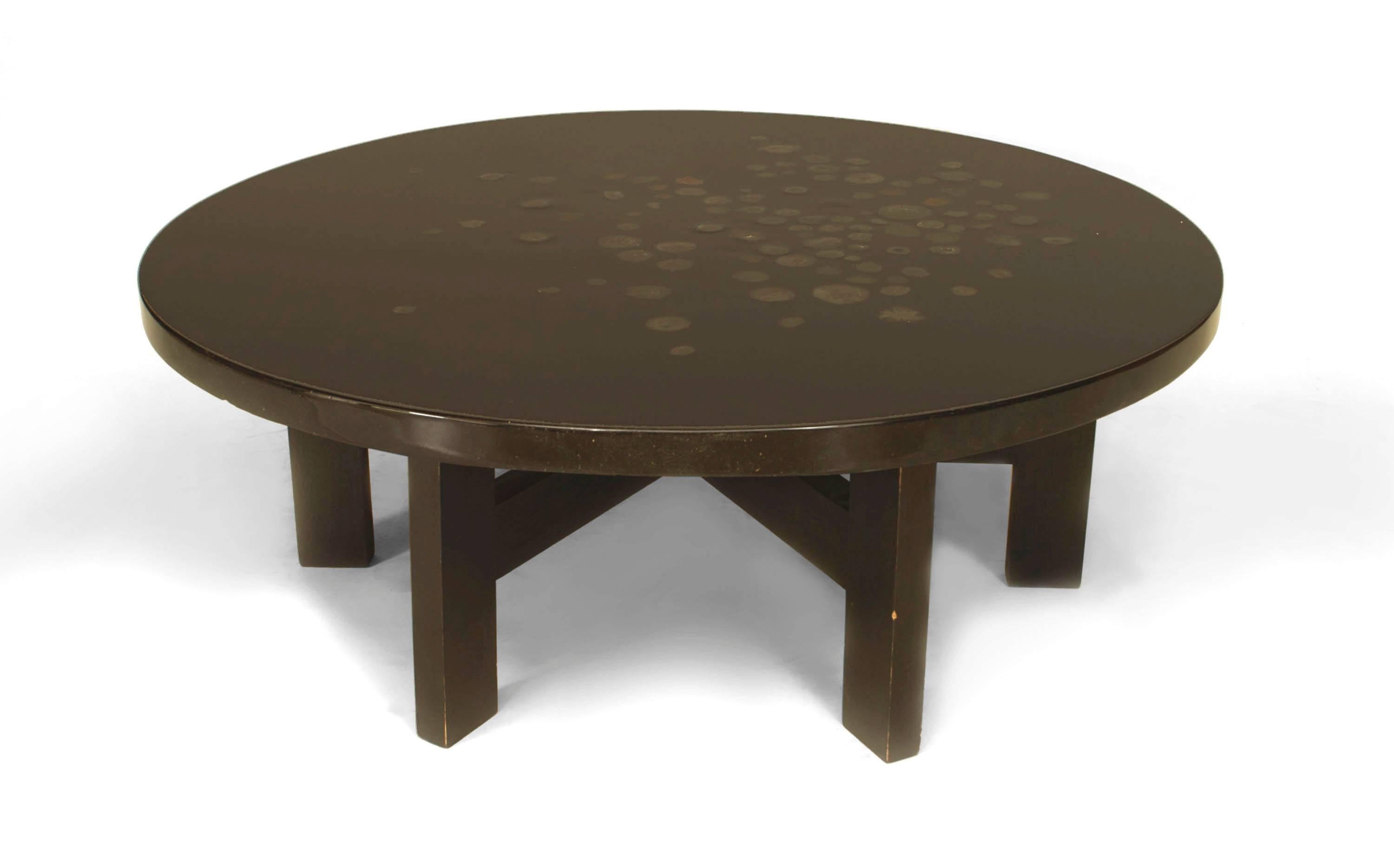 1970's French round coffee table signed by Chale. The table is crafted out of black lacquered resin and inlaid agate top supported on six ebonized wooden legs connected with a stretcher.