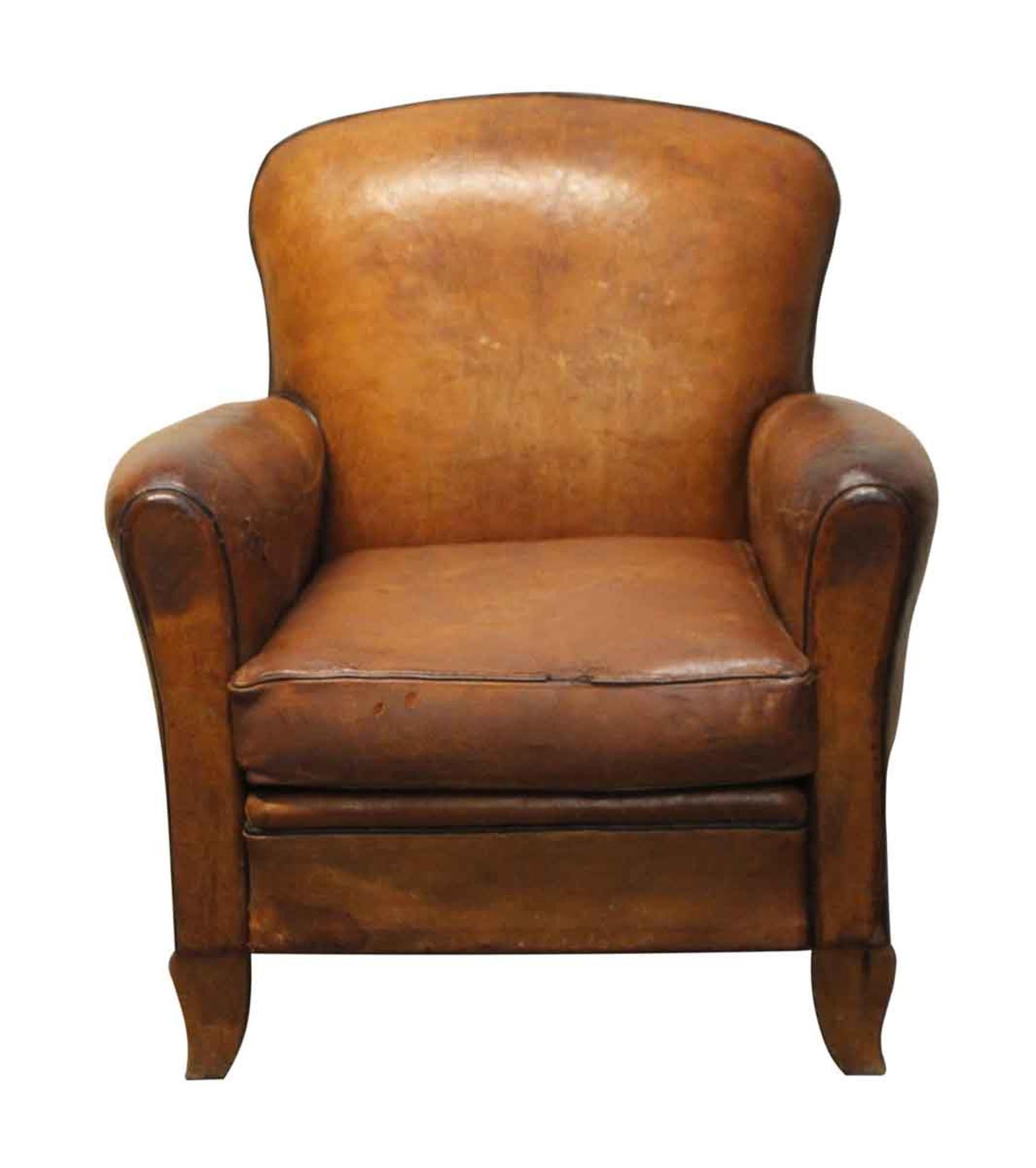 1970s French brown leather club chair. General wear and tear from age and use. This can be seen at our 400 Gilligan St location in Scranton, PA.