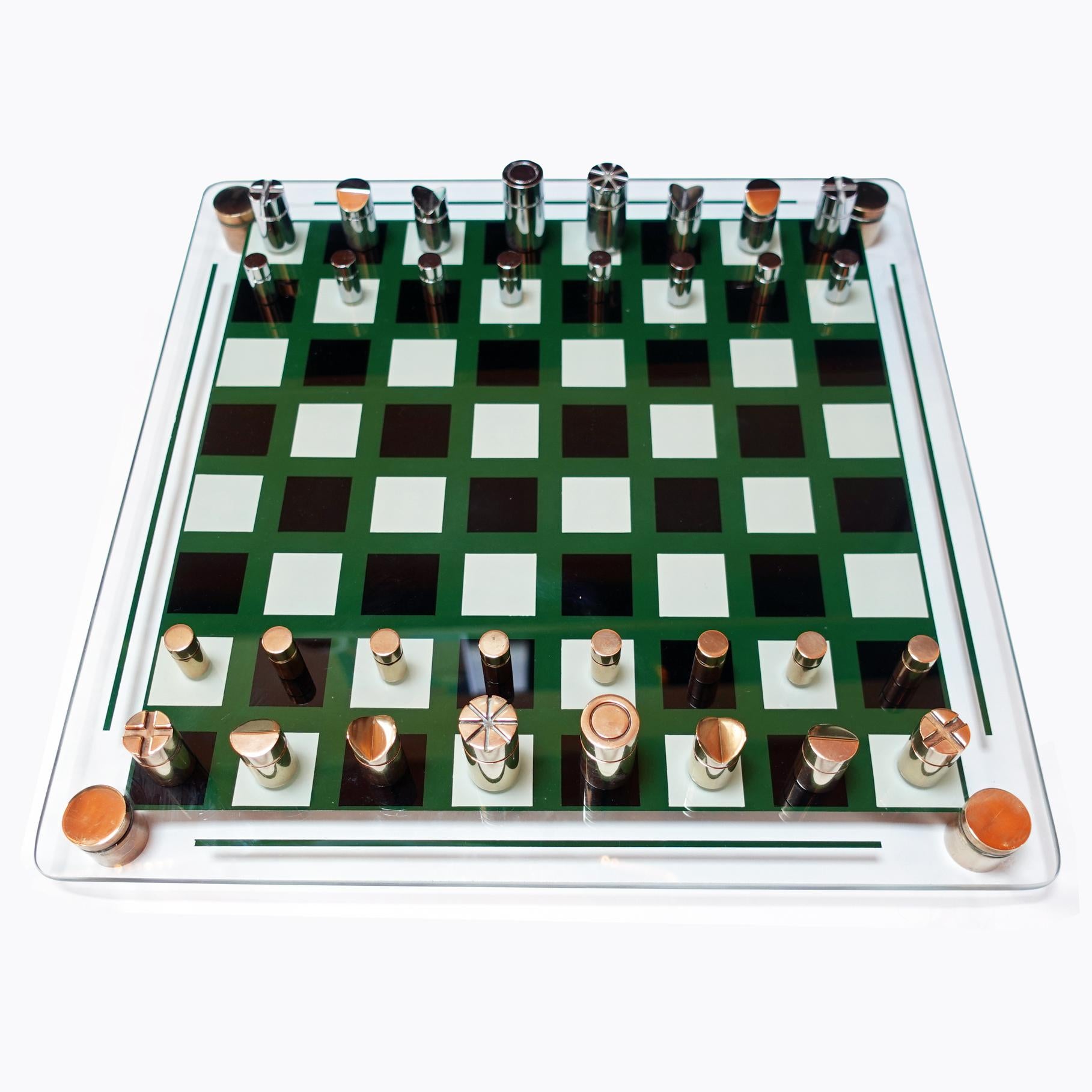 1970s chess set designed and manufactured in France.

Glass board with brass feet. chrome-plated steel and brass pieces.

Chess board measures: 41cm x 41cm x H 2.5cm
King measures: H 4.5cm x D 2.5cm
Pawn measures: H 2.5cm x D 1.2cm.