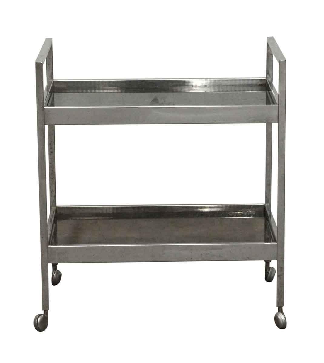 French Mid-Century Modern styling nickel-plated bar cart with two smoked glass shelves from the 1970s. Minor rust around frame. This can be viewed at our Los Angeles location. Please inquire for the exact address.