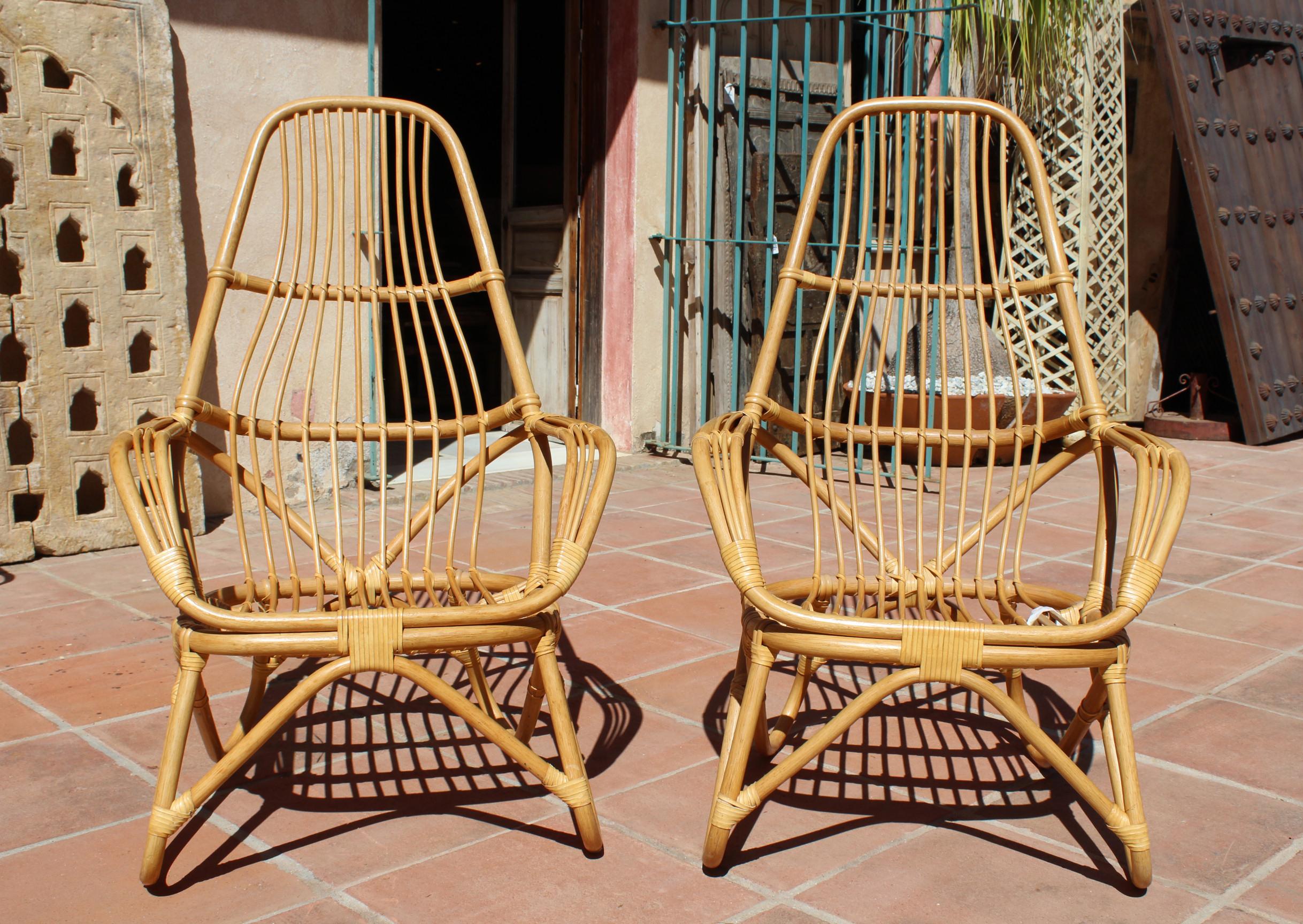 1970s French pair of leather joined bamboo armchairs.
