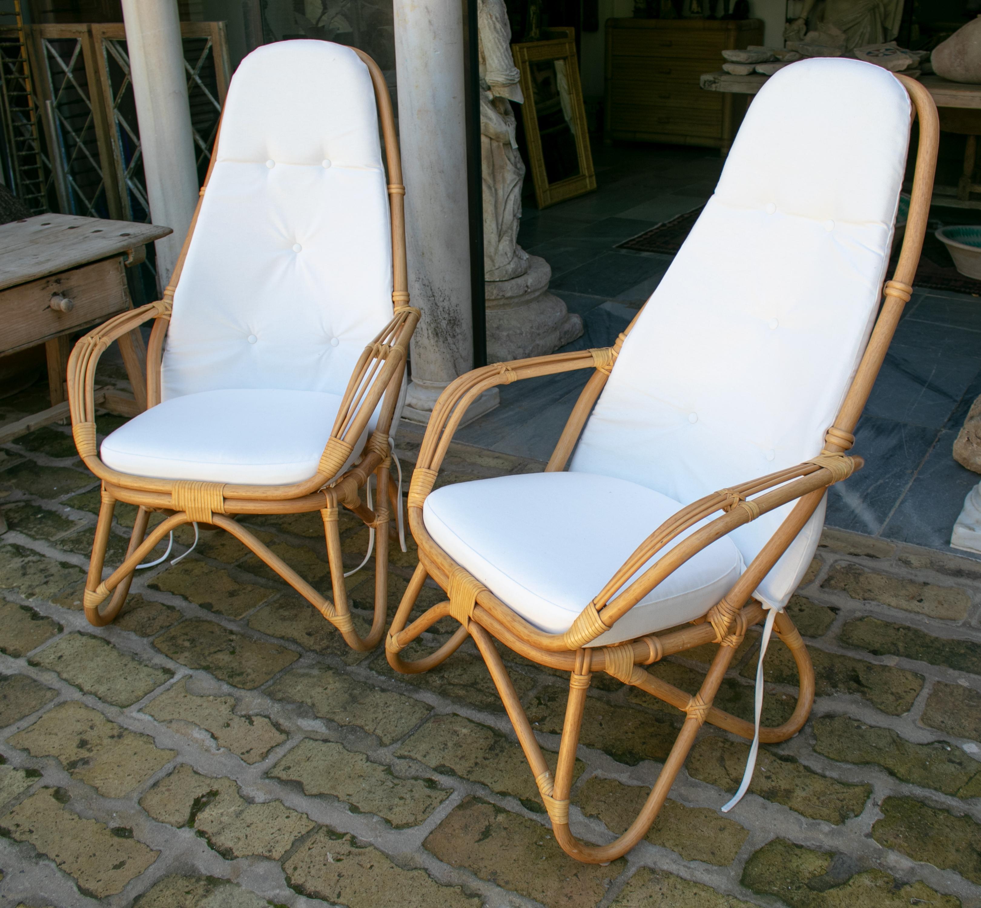 1970s French pair of leather joined bamboo armchairs.
  