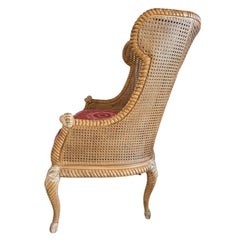 1970s French Provincial Double-Caned Hand-Carved Wingback Chair with Ikat Seat
