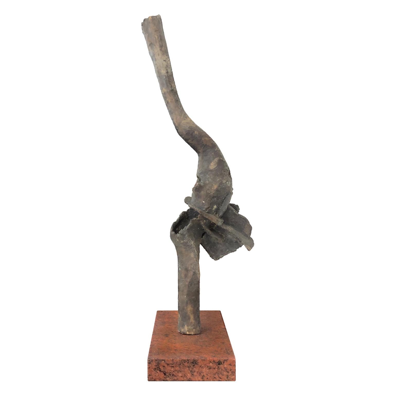Tall abstract bronze sculpture on rectangular stone base. French, 1970s.