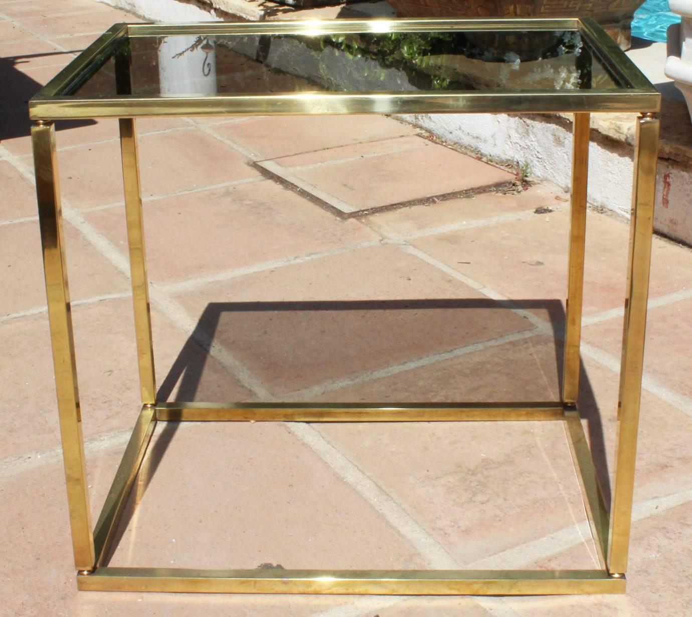 1970s French vintage gilded brass side-table with original glass panels.
 