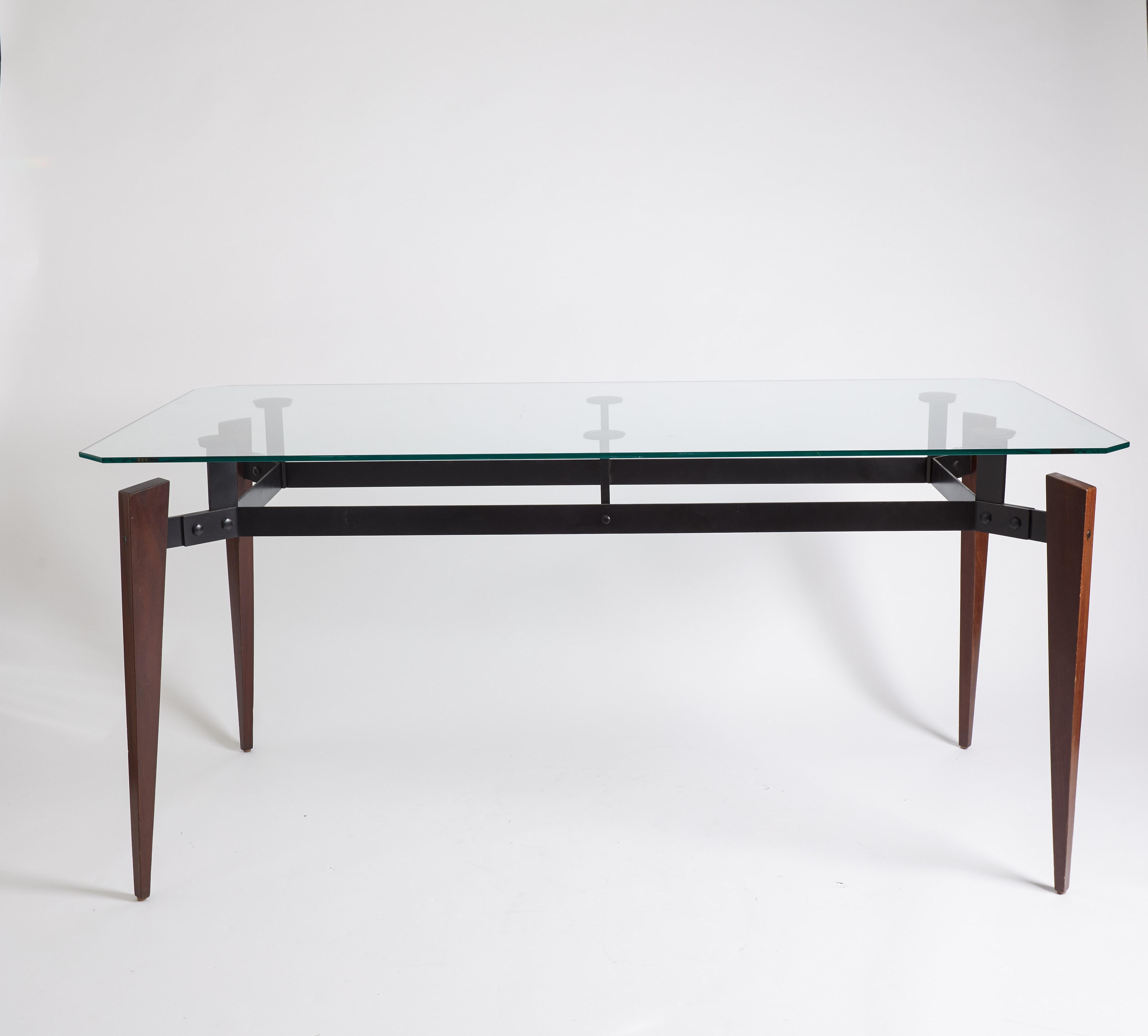 1970s French brown and black walnut wood console table with metal details and glass table top.
