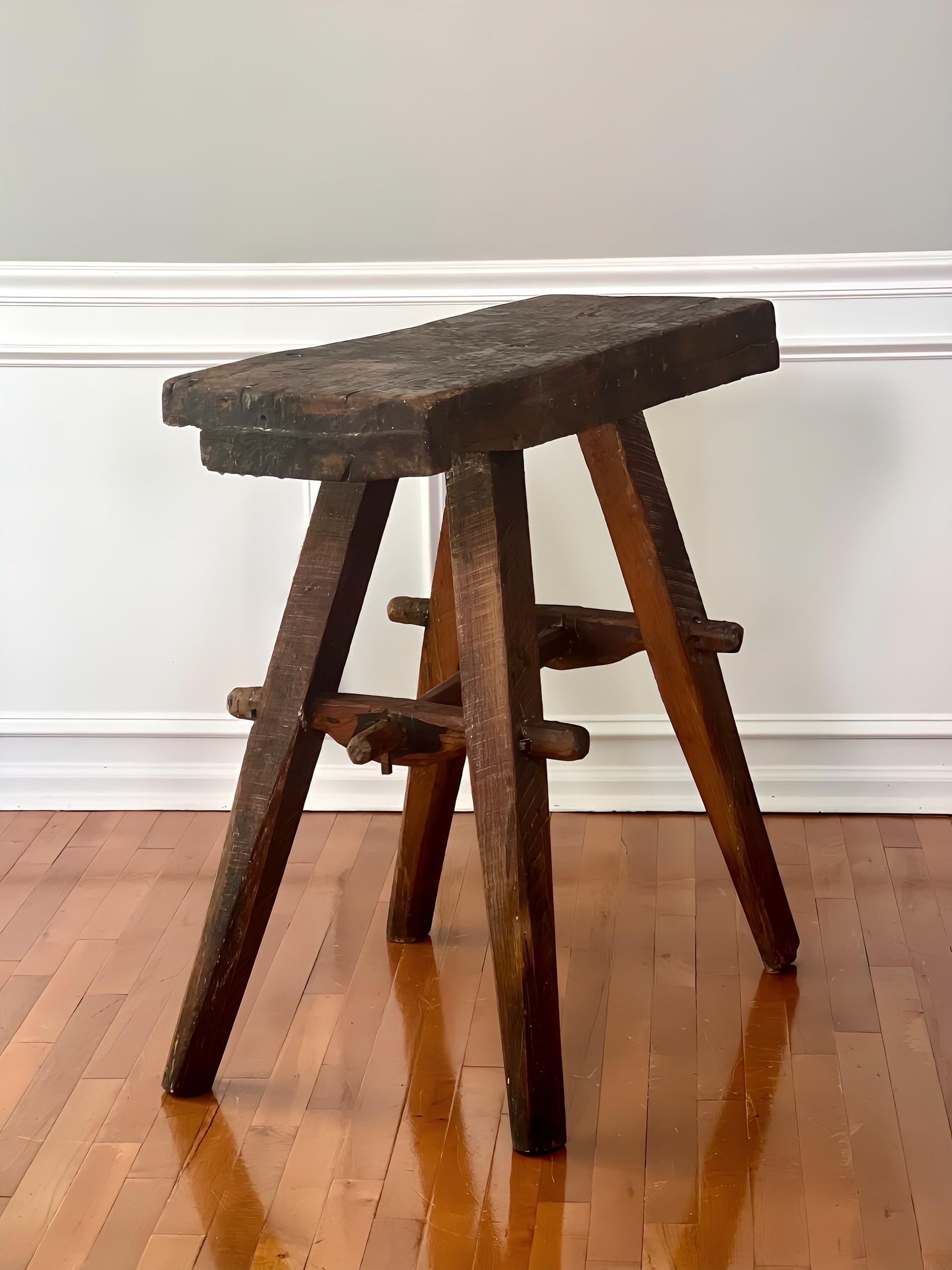1970s handcrafted work bench from the studio of master woodworker and furniture designer, Jeffrey Greene. Crafted by himself in the early years of his career, the work bench displays a rustic, weathered patina from years of Mr. Greene designing and