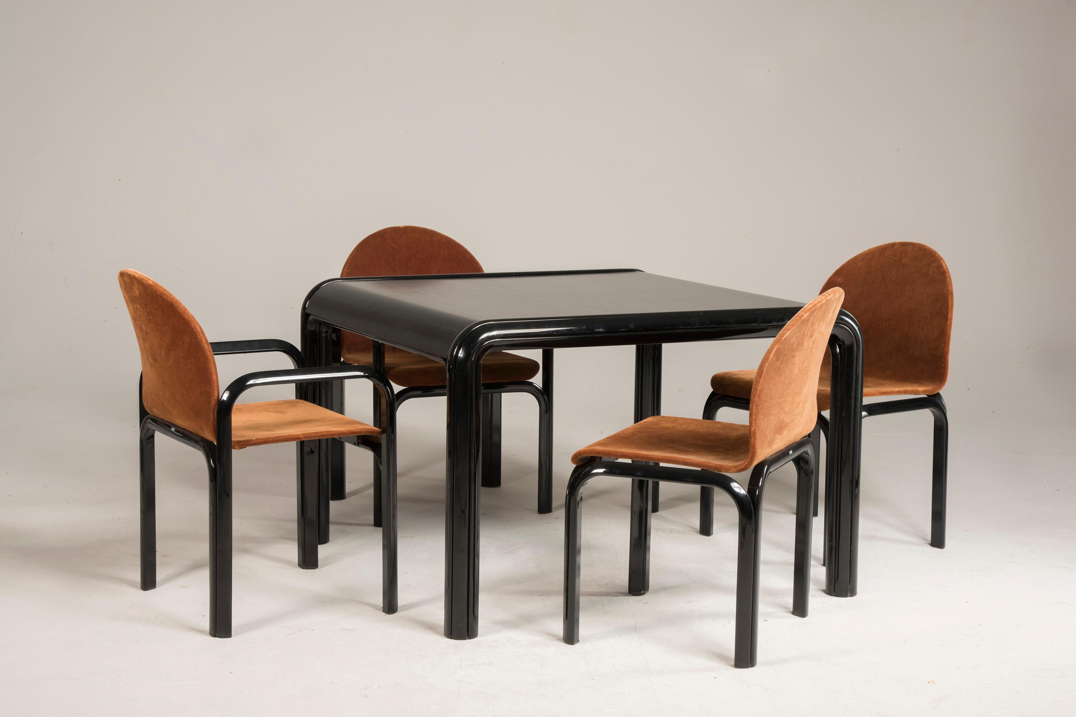 Knoll black wood table and brown velvet chairs
Designed by Gae Aulenti and made by Knoll in 1970s period, this table features black rolled steel frame and black laminate top. The chairs with black extruded aluminum frames have brown velvet recent