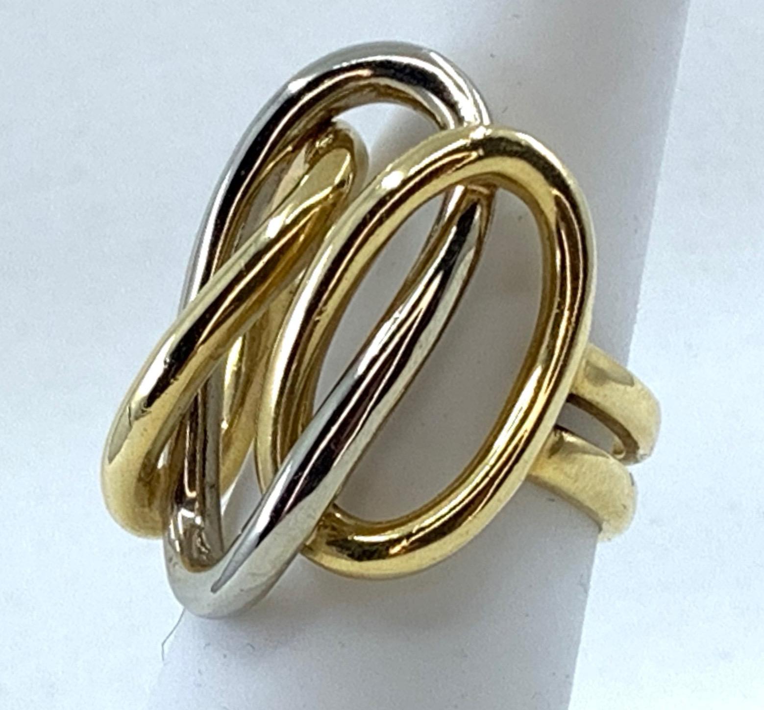 We don't see many no-stone rings with this much presence but Garavelli pulls it off with a modern design, strong color contrast and unapologetically generous proportions.  Two side ovals in richly hued 18 karat yellow are linked with a center a