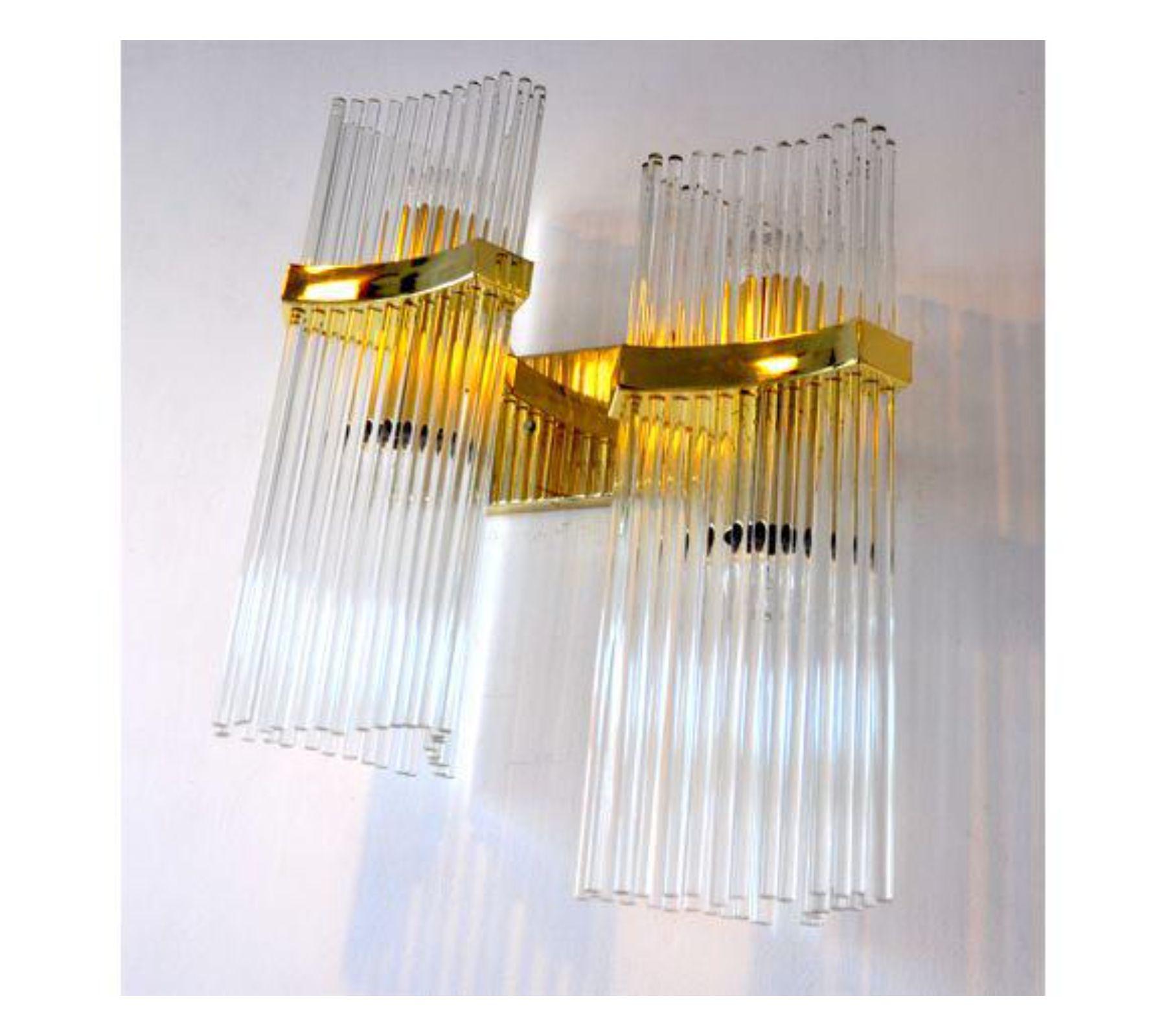 Rare wall sconce designed by Gaetano Sciolari for Lightolier in Italy, circa 1970. Gold platted metalic structure composed of more than 70 Murano crystals sticks. A magnificent sconce and unique piece of design that will be great a highlight to your