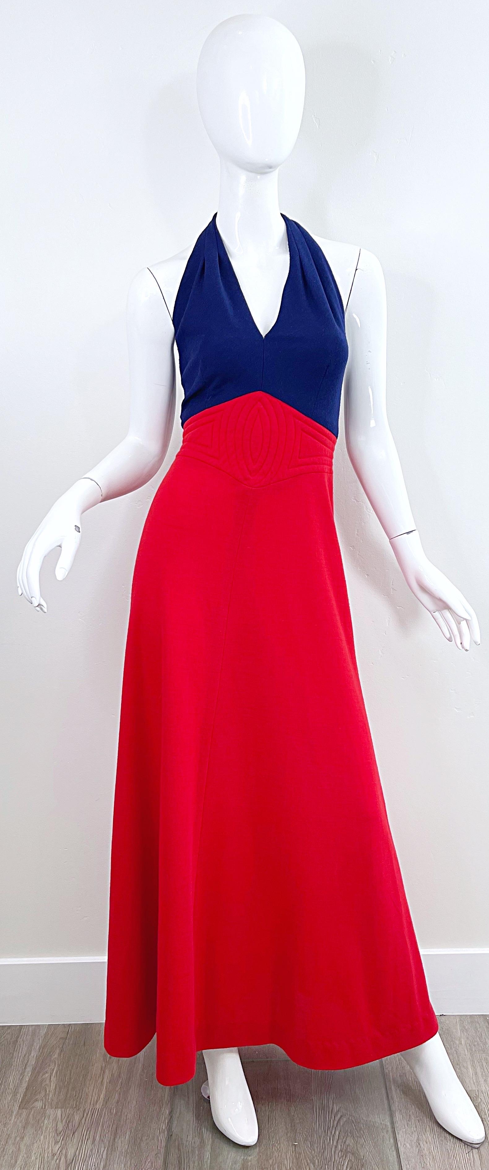 Chic vintage 70s GAY GIBSON navy blue and red wool halter maxi dress ! Features a tailored navy bodice with a full red skirt. Hidden zipper up the back with hook-and-eye closure. Hook-and-eye closures at back neck as well. 
In great condition
Made