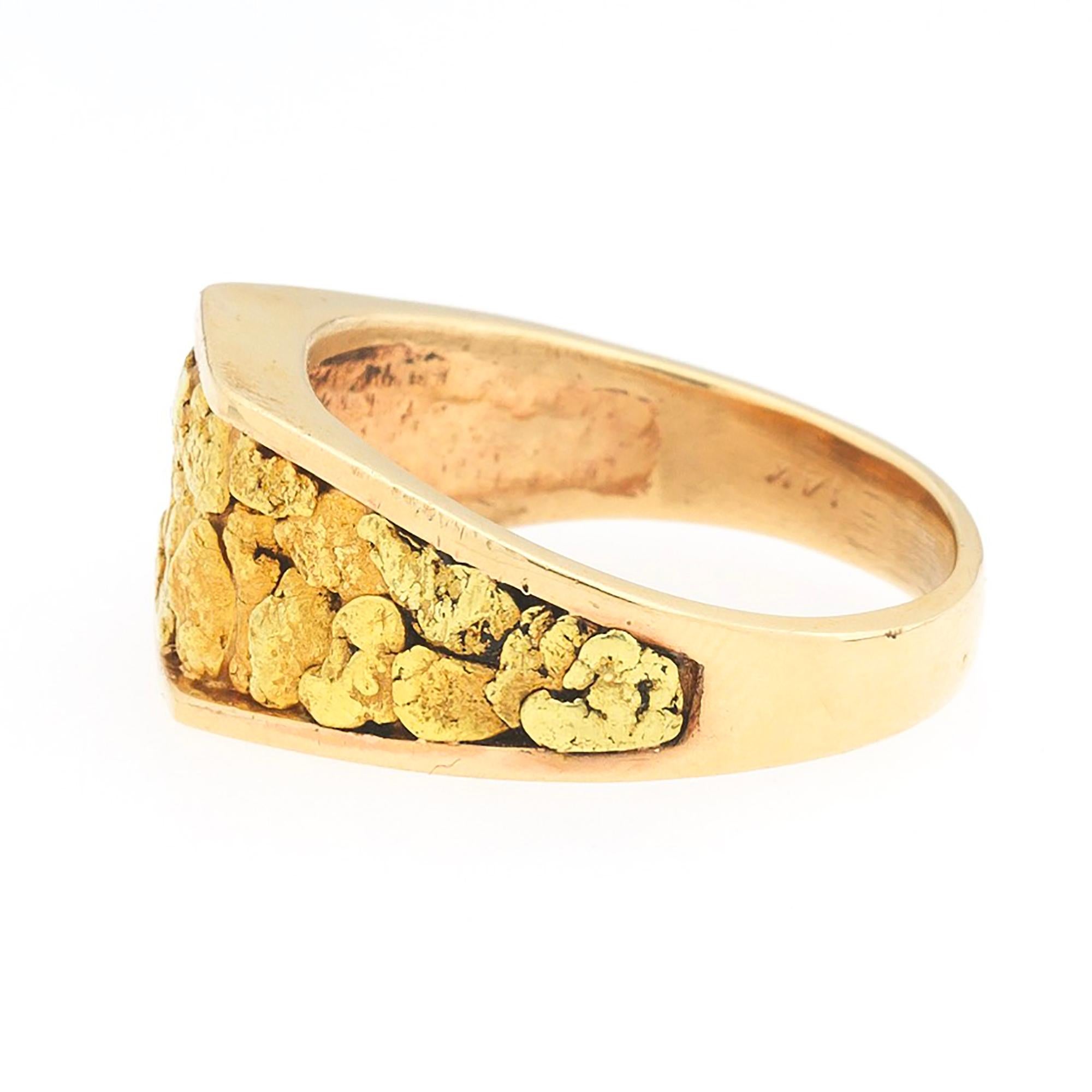 A custom made 14K rose gold ring set with 22K yellow gold nugget texture in the center, circa 1970's. Suitable as an alternative to a wedding ring or otherwise.  Ring is finger size 11 3/4 and can be easily resized by a jeweler of your choice if
