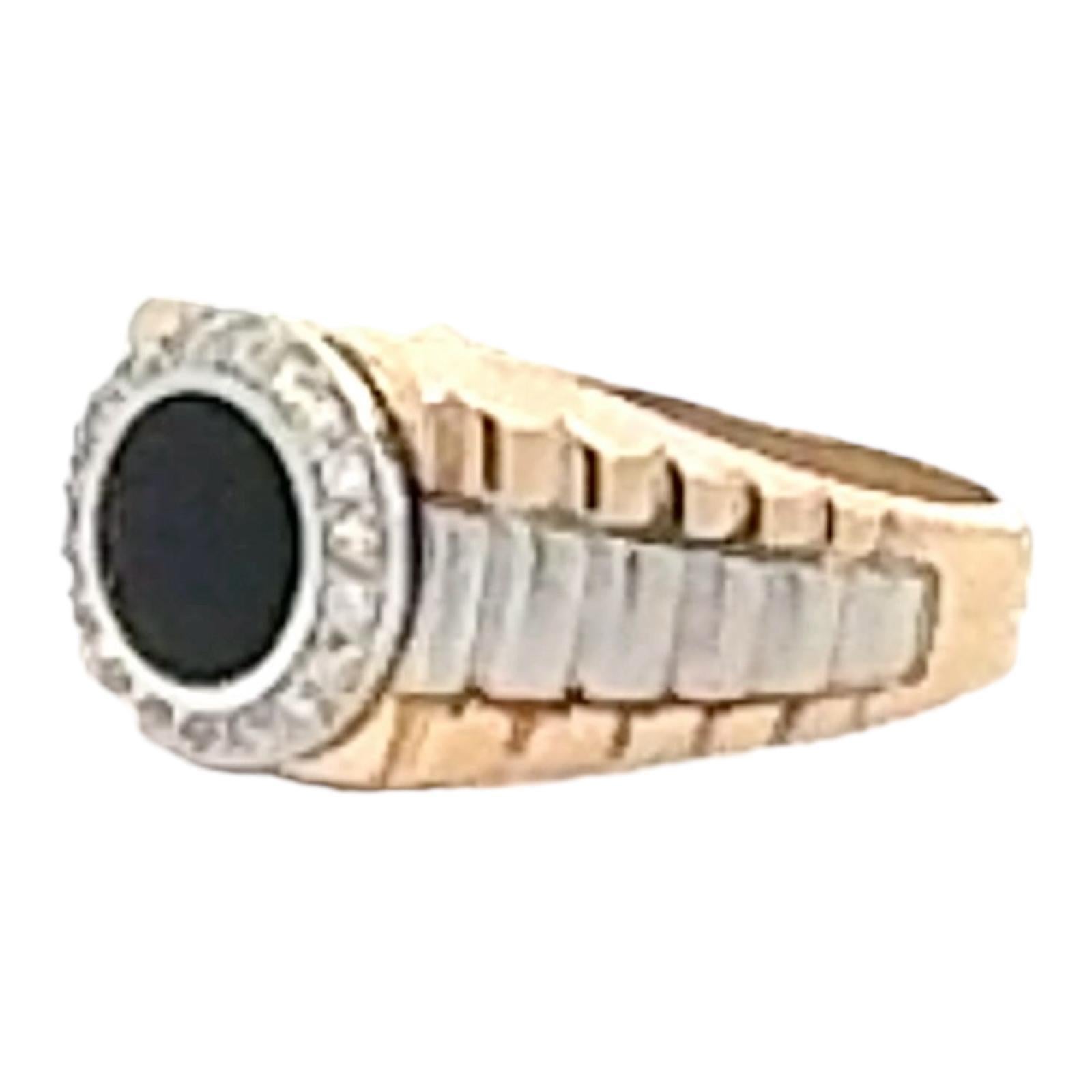 Gent's Rolex Style ring crafted in 14 karat yellow & white gold. The ring features a cabochon black onyx gemstone and round brilliant cut diamonds weighing approximately .25 carat total weight and graded I color and SI clarity. The ring measures .50