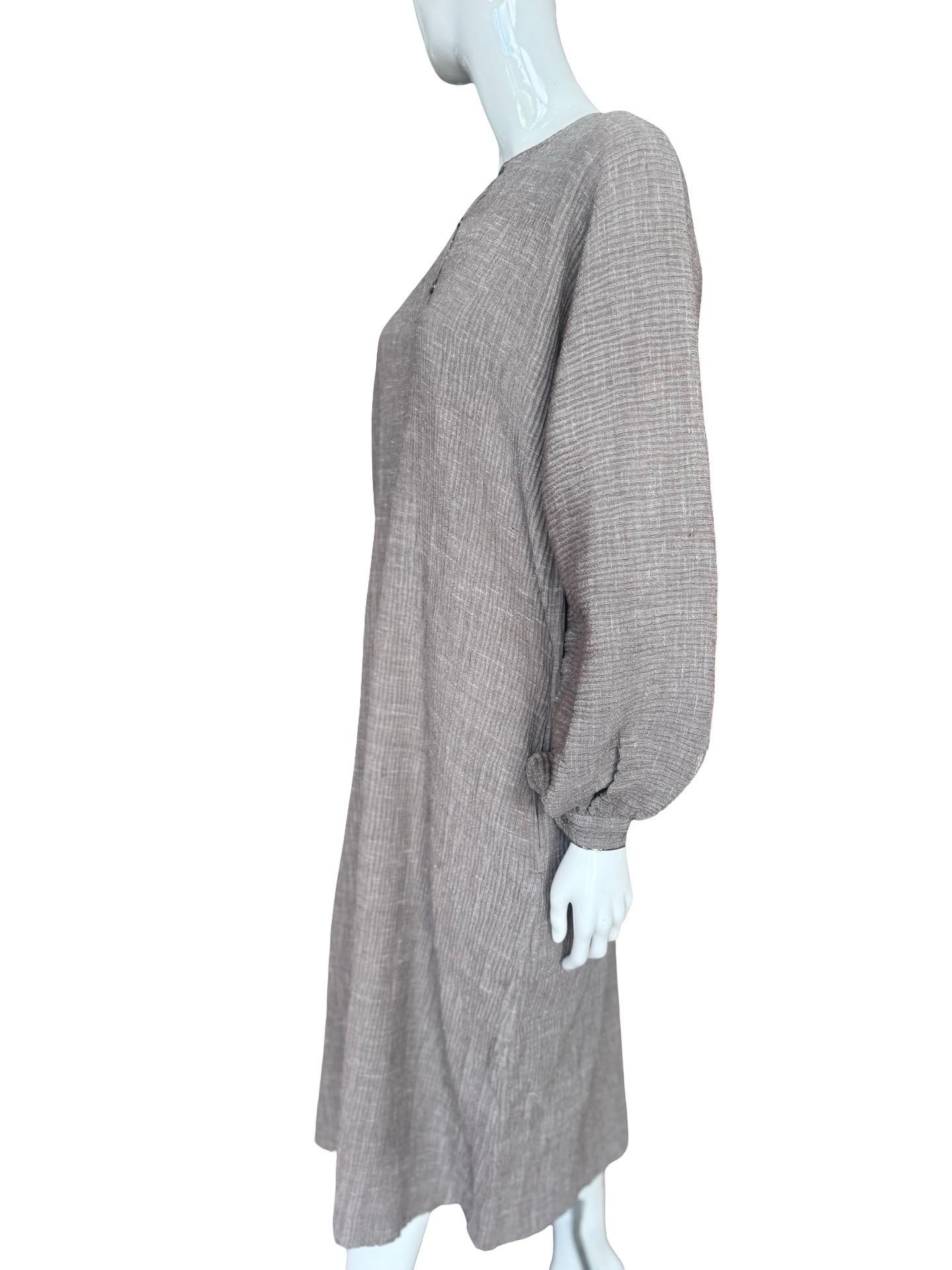 Stunning piece from 60s/70s Geoffrey Beene in a neutral taupe or sort of a cafe au lait color.  No fabric tag but likely a cotton mix but it is a slightly thicker fabric and holds this strong pleating - plenty of stretch to it.  The kaftan has a