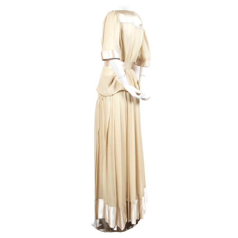 Cream, sheer silk ensemble with contrasting stain trim, matching belt and metallic gold thread designed by Geoffrey Beene dating to the late 1970's. Fits a US 4-6. Top measures approximately 40