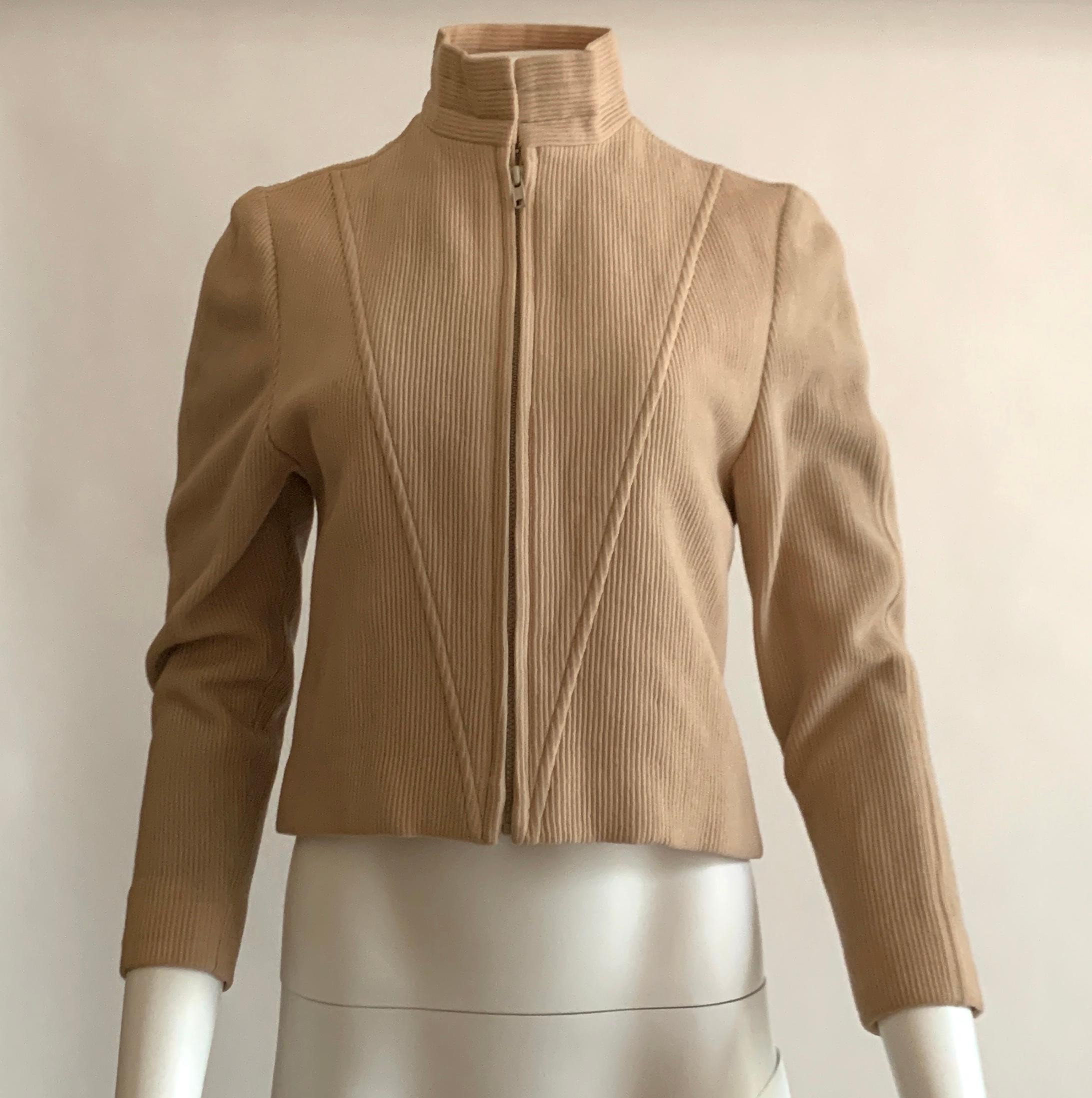 Vintage Geoffrey Been light tan rib knit moto style jacket. Long sleeve, seam detailing at front. Zip front, two hook and eyes at neck. 

Content unknown, feels like wool blend. 
Fully lined.

No size label, best fits S. See measurements.
Bust