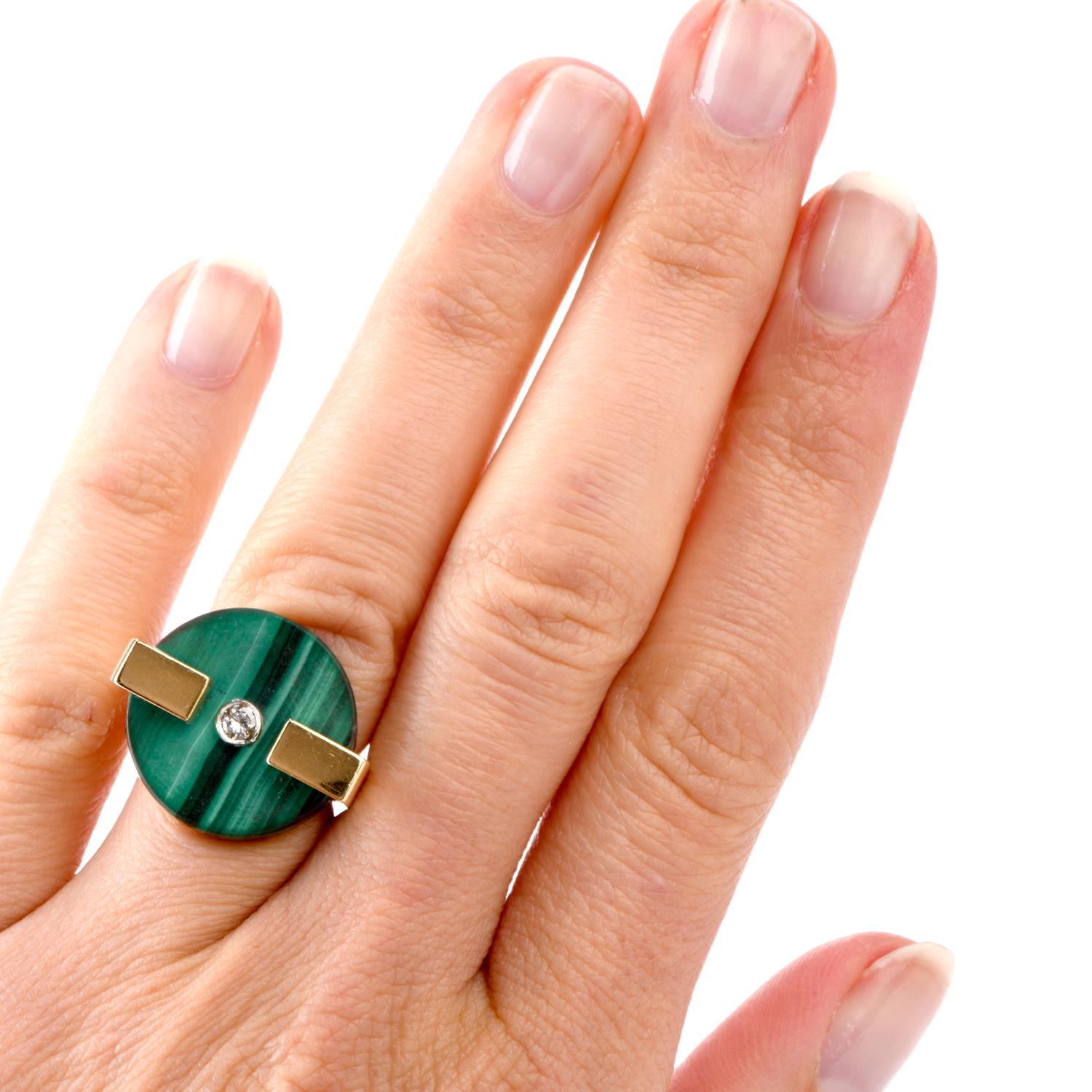 Like Shapes and Dimension? This vintage 1970's ring is for you! Featuring a thick Round disc of Malachite measuring appx. 19mm in diameter

and 3.74mm deep, this Square shaped ring was crafted in 18K yellow gold. Contrasting the green disc is 1