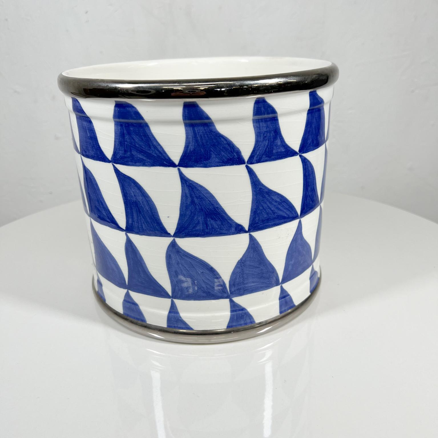 Made in Italy by Este Ceramiche for Tiffany white planter with blue and silver decoration.
1970s Geometric planter pot by Tiffany & Co Este Ceramiche ITALY.
Measure: 7.75 tall x 8.5 
Preowned original vintage condition.
See images provided.
 