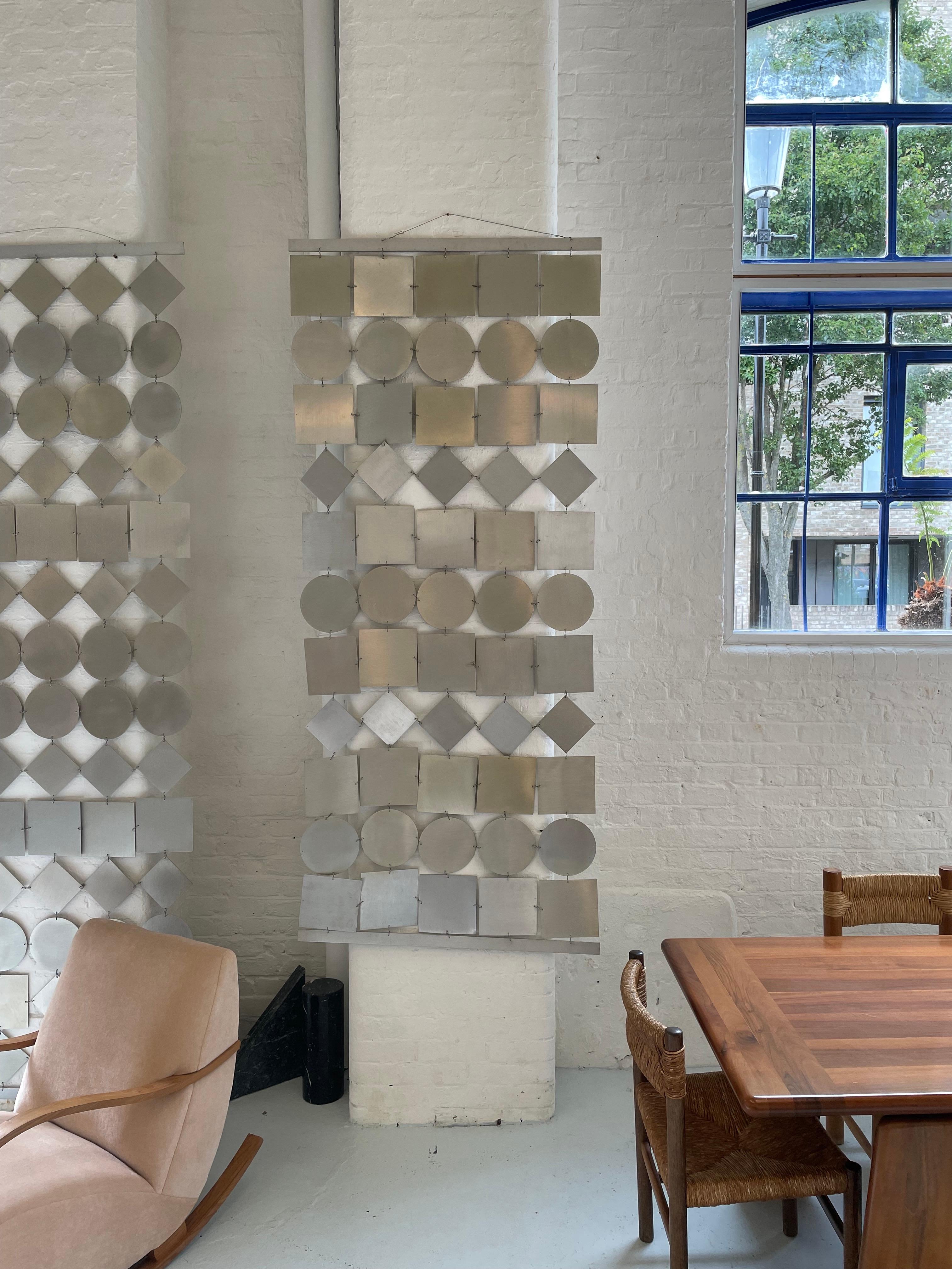Made from Brushed Steel in the 1970s. The Geometric Screen/Room Divider is an ideal addition to modern, contemporary, or even eclectic interiors, as it adds a touch of sophistication, structure, and visual depth to any room.