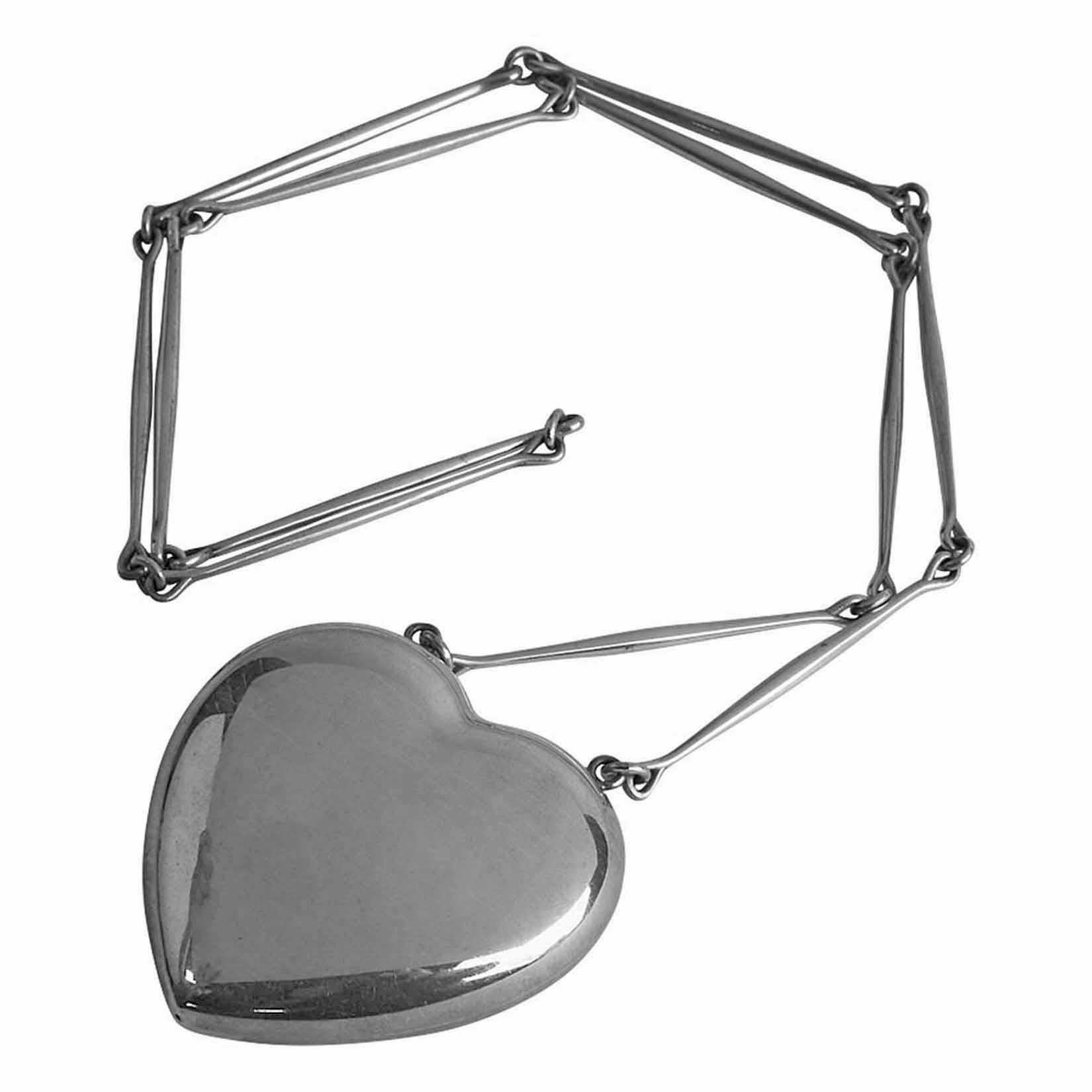Large Georg Jensen Astrid Fog Joy Pendant Necklace, handmade, design number 126. The large heart pendant suspended from a necklace of twelve bar-form links. Pendant: 2 ½ inches. Necklace: 30 inches. Total Item Weight: 101 grams. Full Jensen marks.