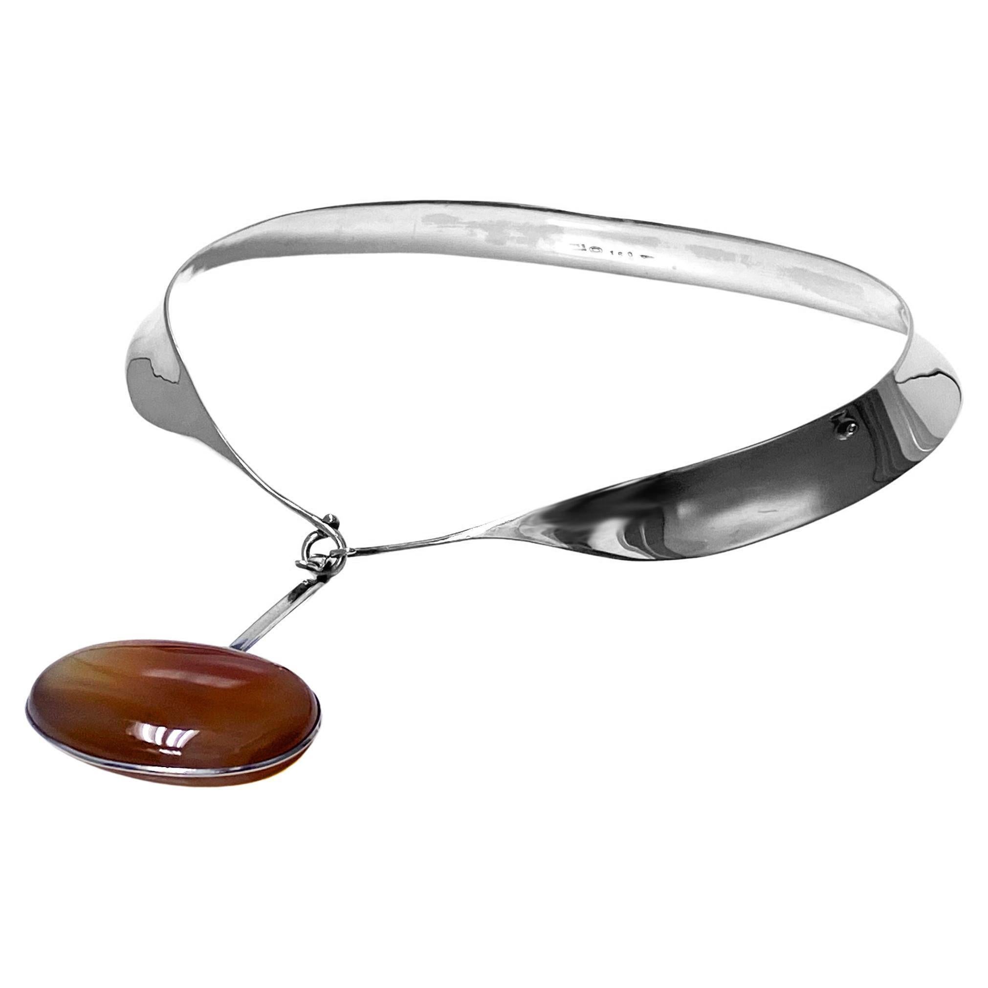 Vivianna Torun Bulow Hube for George Jensen, a rare Sterling Silver Necklace with reddish brown banded agate detachable pendant on collar, Denmark, C. 1975, stamped Georg Jensen in a dotted oval, Denmark, Torun, 133 pendant and 160 collar and 925S.