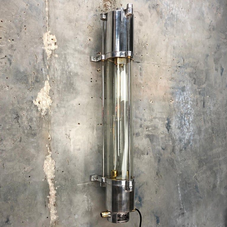 This is a vintage 1970s German industrial aluminium and flameproof glass tube wall strip light modified with Edison LED tubes. 

There are details of the manufacturer and original specification found on the tag found at the top of the fixture,