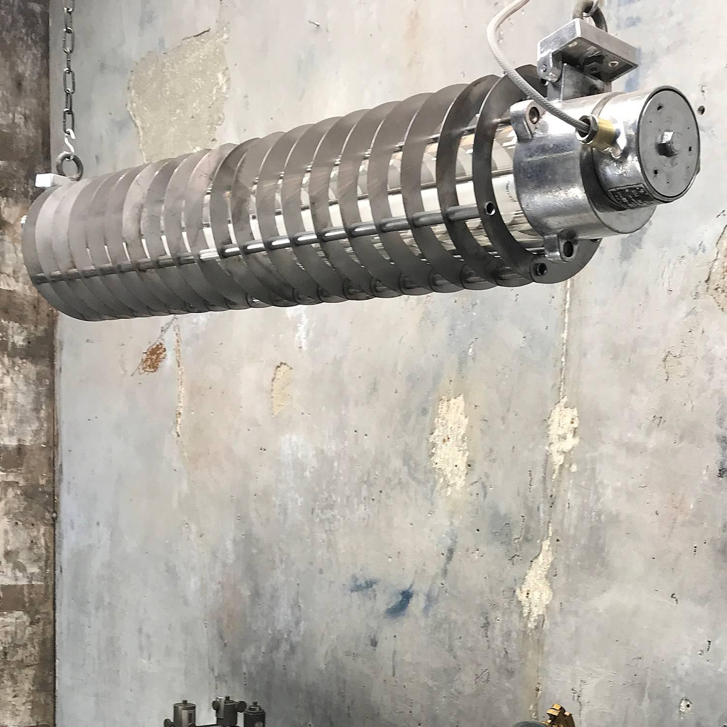 German flame proof strip light with shades.

These lights have just arrived with us and are even more substantial and impressive than the photo's show, a real example of vintage Industrial lighting that you just don't see these days, in fact it