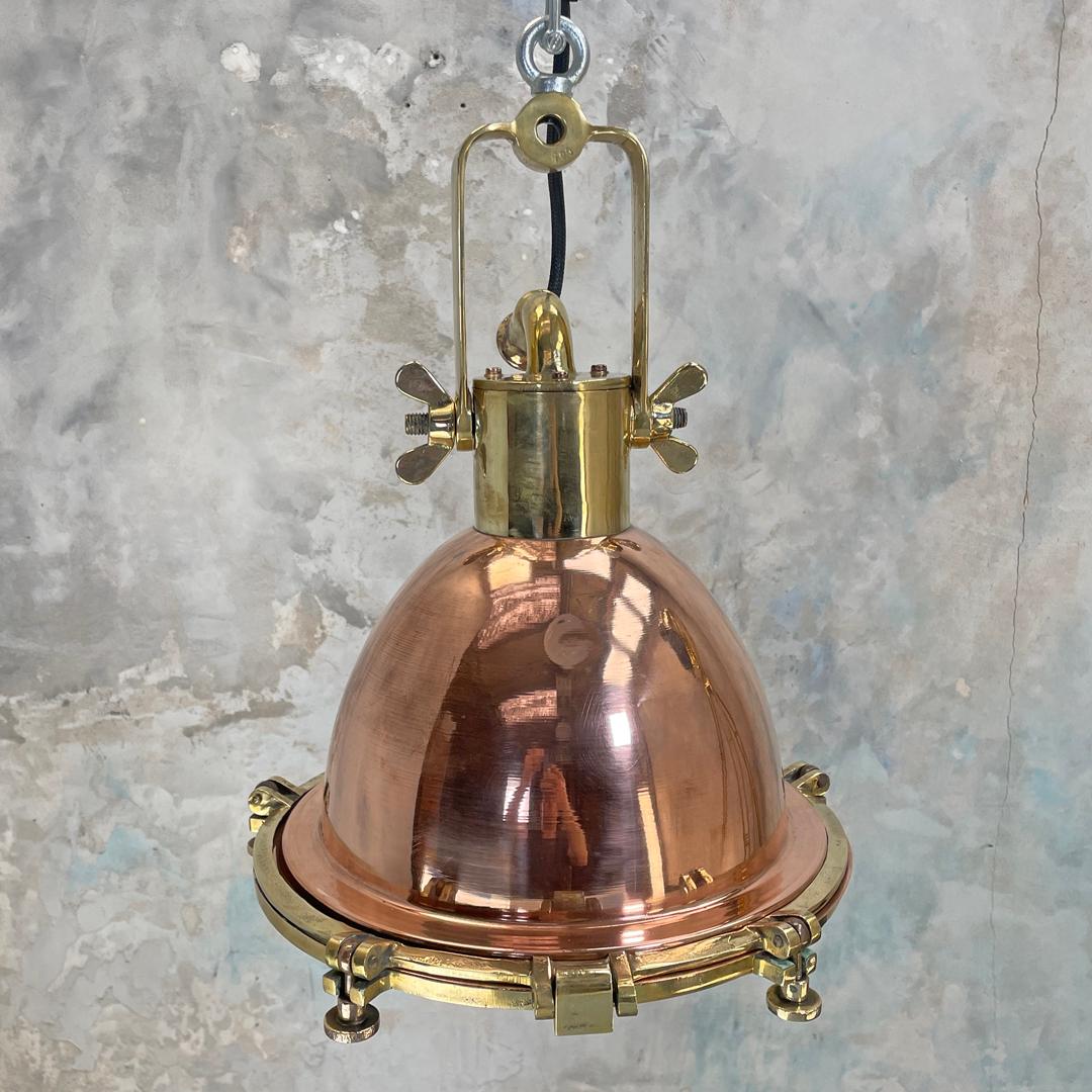 A copper and brass industrial style ceiling light. This original industrial light fixture is manufactured by Wiska who are a German manufacturer of marine grade fixtures and fittings.

Beautiful copper feature lighting for vaulted ceilings, kitchen