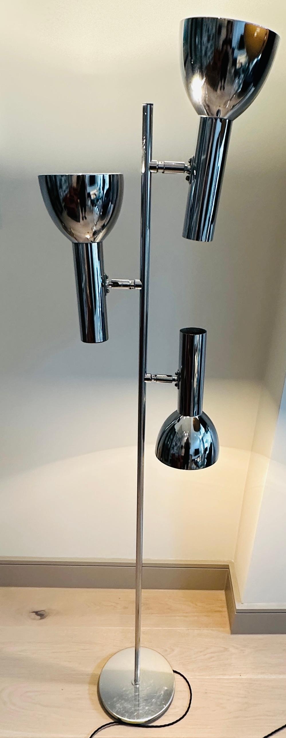 A directional, adjustable, chromed metal, three-shade floor lamp manufactured by Cosack Leuchten in Germany during the 1970s.  The interior of each the the three shades is sprayed white and the polished chrome exterior is in very good condition. The