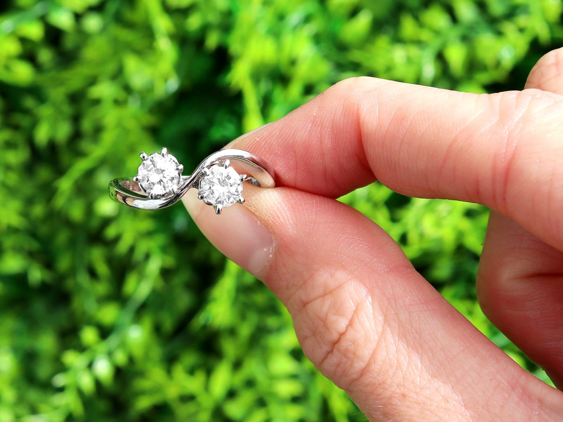 A fine and impressive vintage 0.86 carat diamond (total) twist ring in 14 karat white gold; part of our diverse diamond jewelry and estate jewelry collections.

This fine and impressive vintage diamond twist ring has been crafted in 14k white