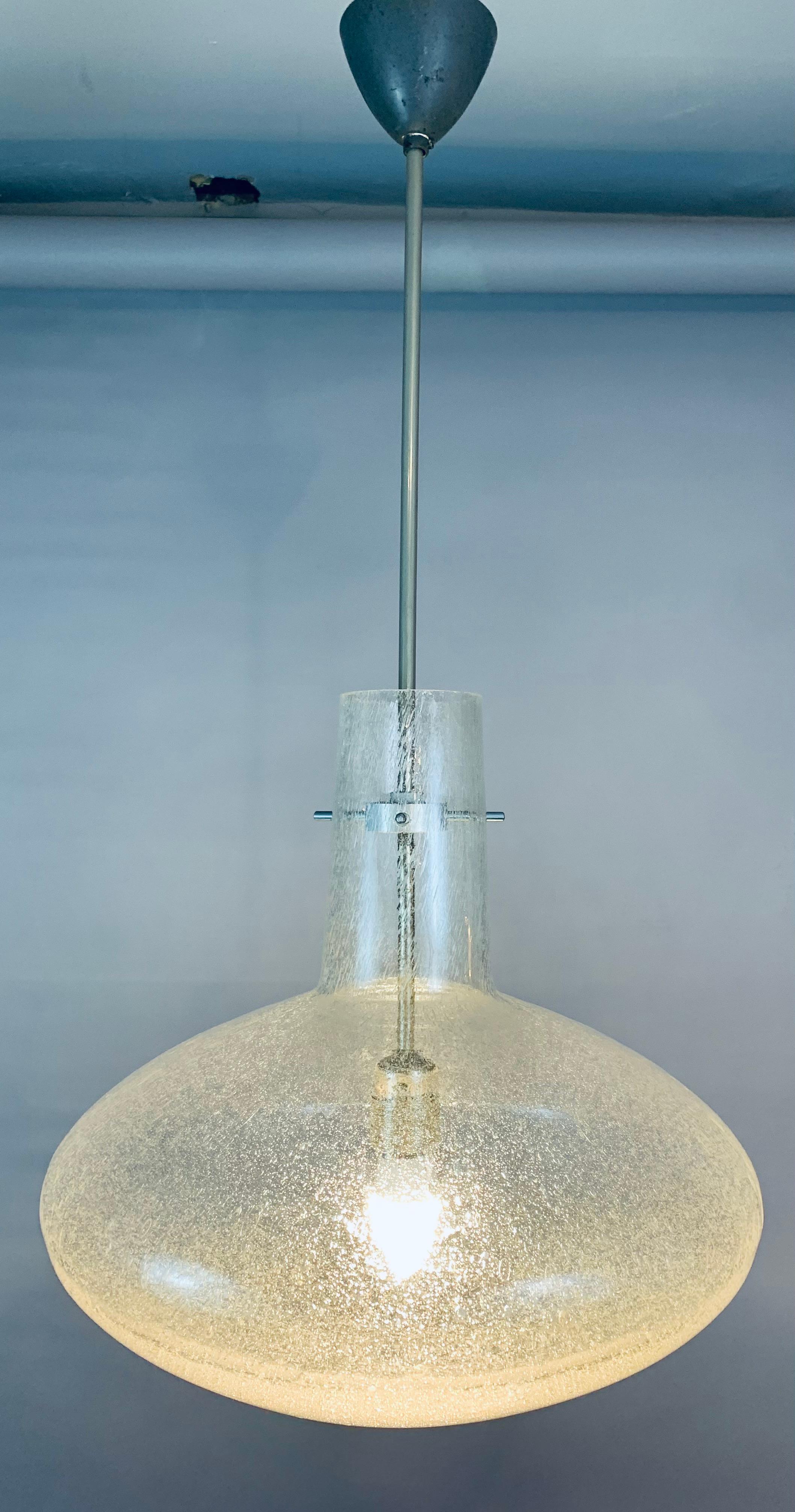 1970s German Doria Leuchten bubbled flask-shaped ceiling hanging light. The suspended glass shade is held onto the brushed chrome ceiling rod with three screw in rods which when unscrewed release the shade to make it easy to clean and replace the