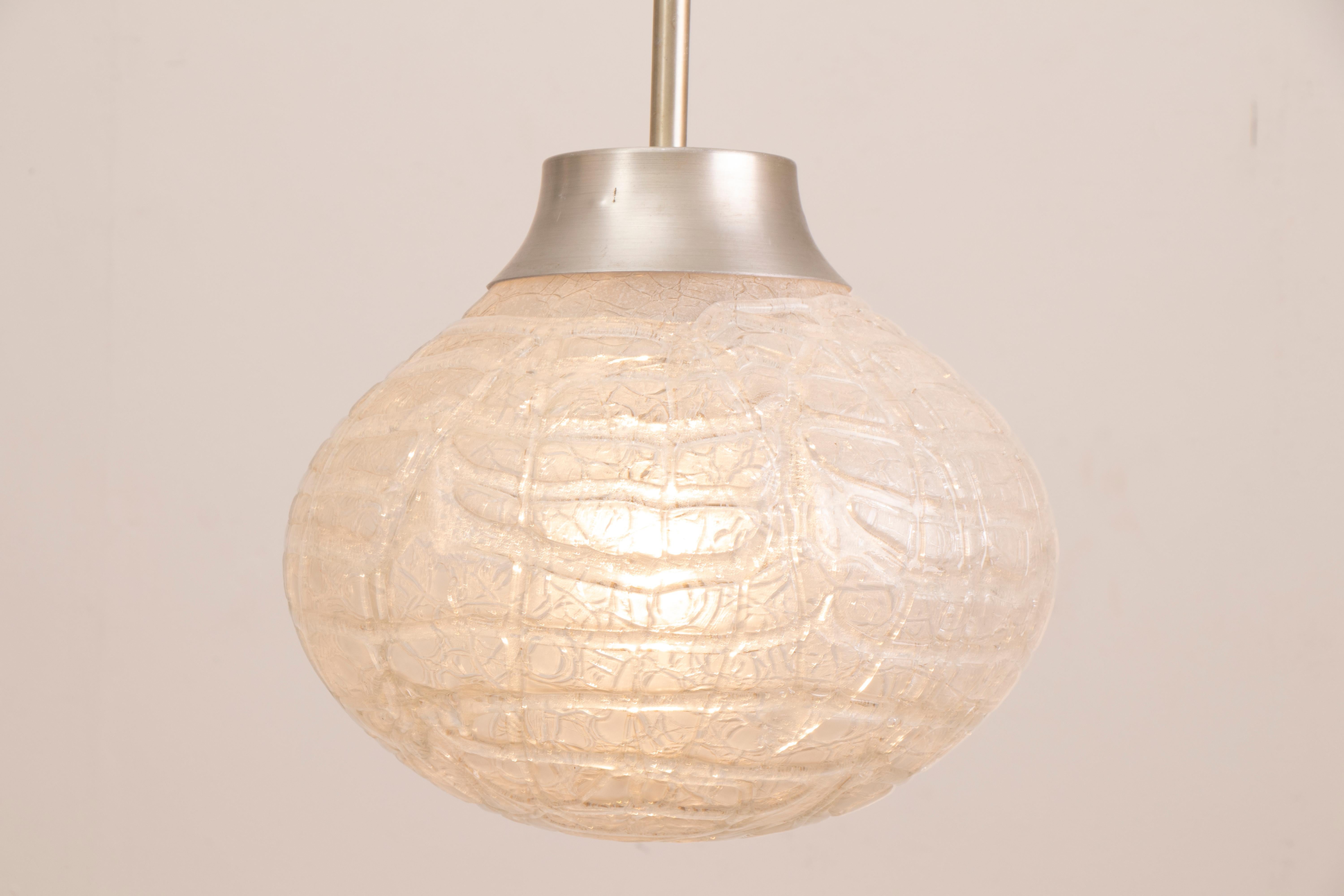 1970s bulbous, crackle, frosted, glass, pendant, hanging-light manufactured by Doria Leuchten, Germany. The glass globe is suspended from a polished chrome fixture and black wire flex which can be adjusted to your specific height requirements. A