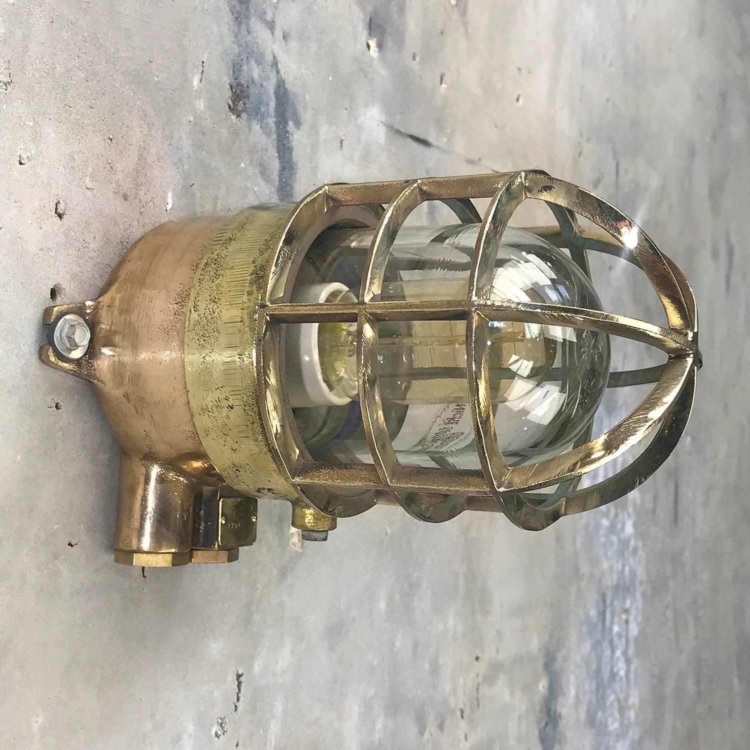 Solid cast bronze and brass explosion proof pendant manufactured, circa 1975. Ex. rated
 
It has the original ceramic and brass E27 lamp holder which looks brand new, and is completely free from chips / damage. 
 
Reclaimed from super tankers