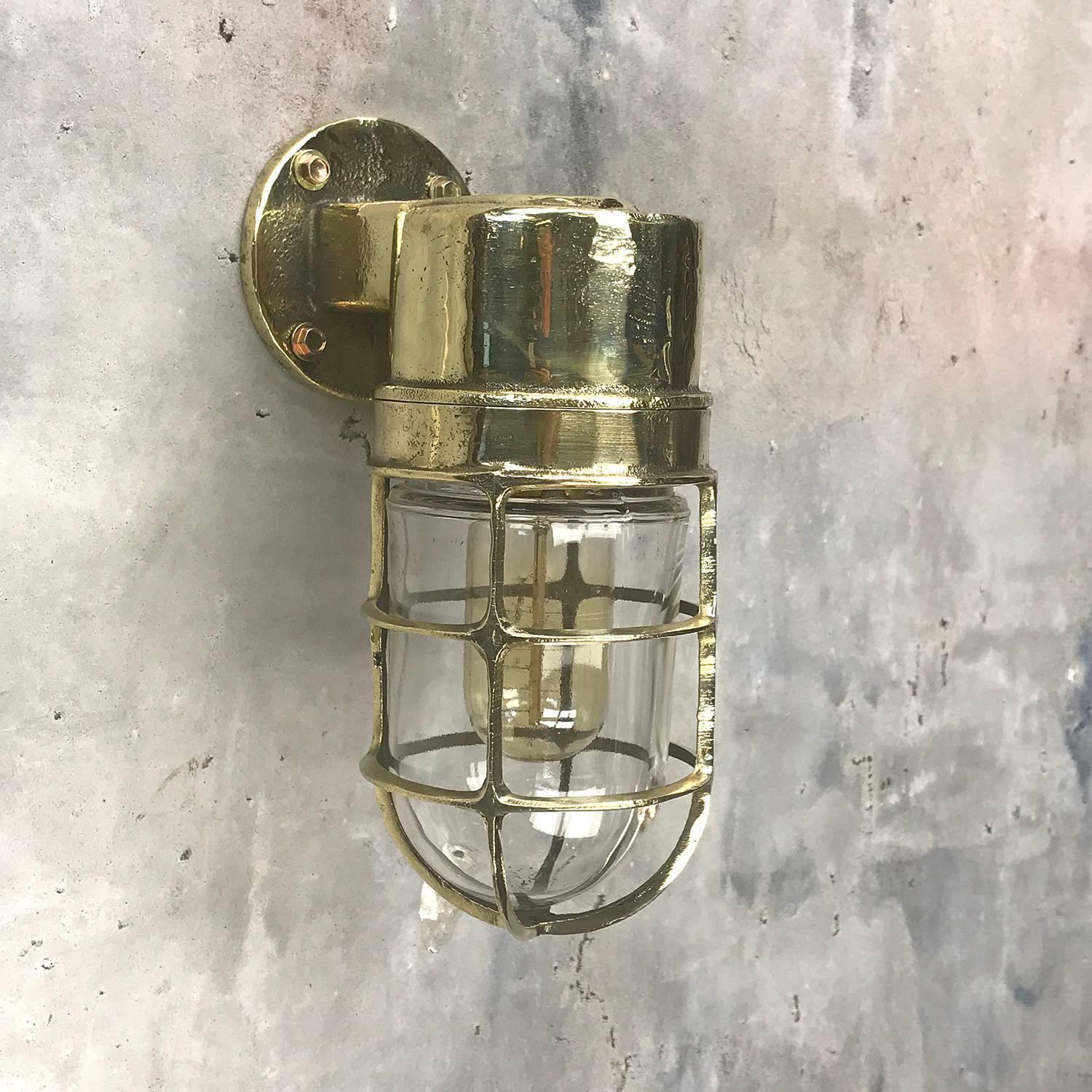 Made in Germany these lights were salvaged from cargo ships and supertankers made during the 1970's, they are a substantial brass casting with a tempered glass dome and cast brass protective cage.

Restored, re-wired and factory tested by