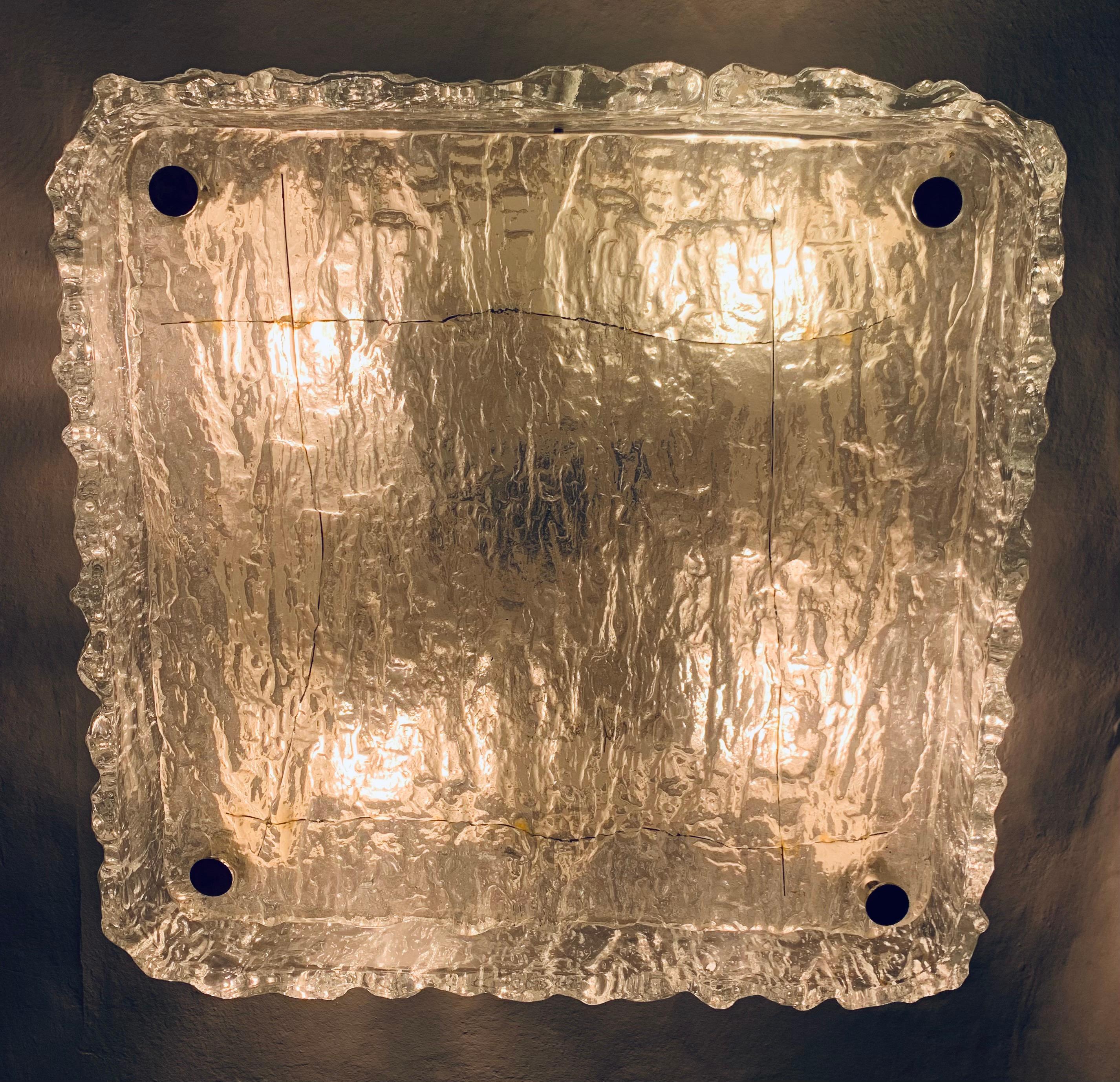 1970s, square, iced, textured, murano glass, flush mount, ceiling light. Manufactured by Kaiser Leuchten in Germany. The thick textured glass is mounted onto a white metal frame which fixes to the ceiling. 4 chrome screws hold the square glass shade