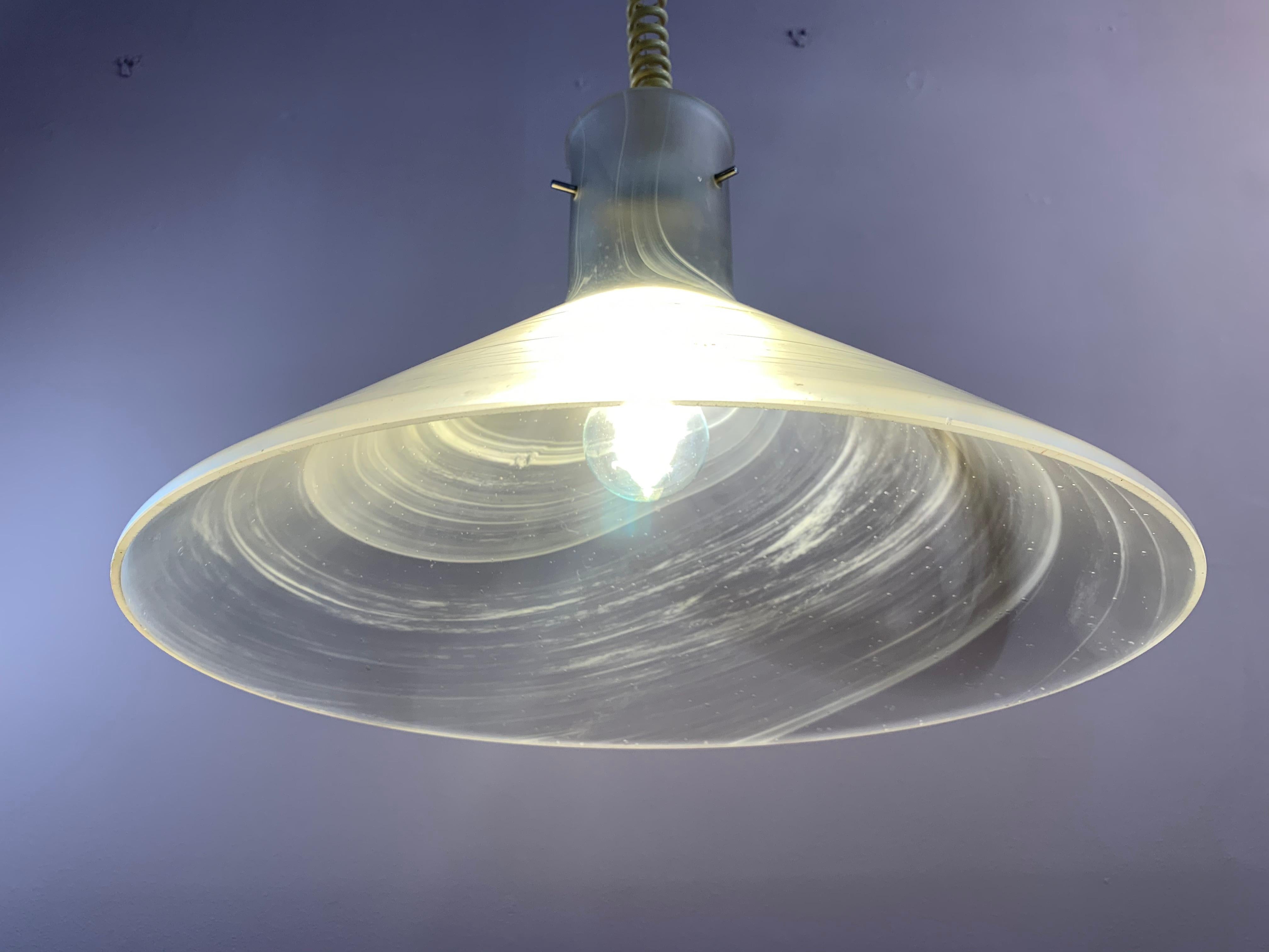 1970s, German, Peill & Putzler, conical, opaque glass, ceiling hanging light. The shade is made from thick glass with an opaque, circular, whirlpool effect pattern around the outside with some small feature bubbles throughout. The height is