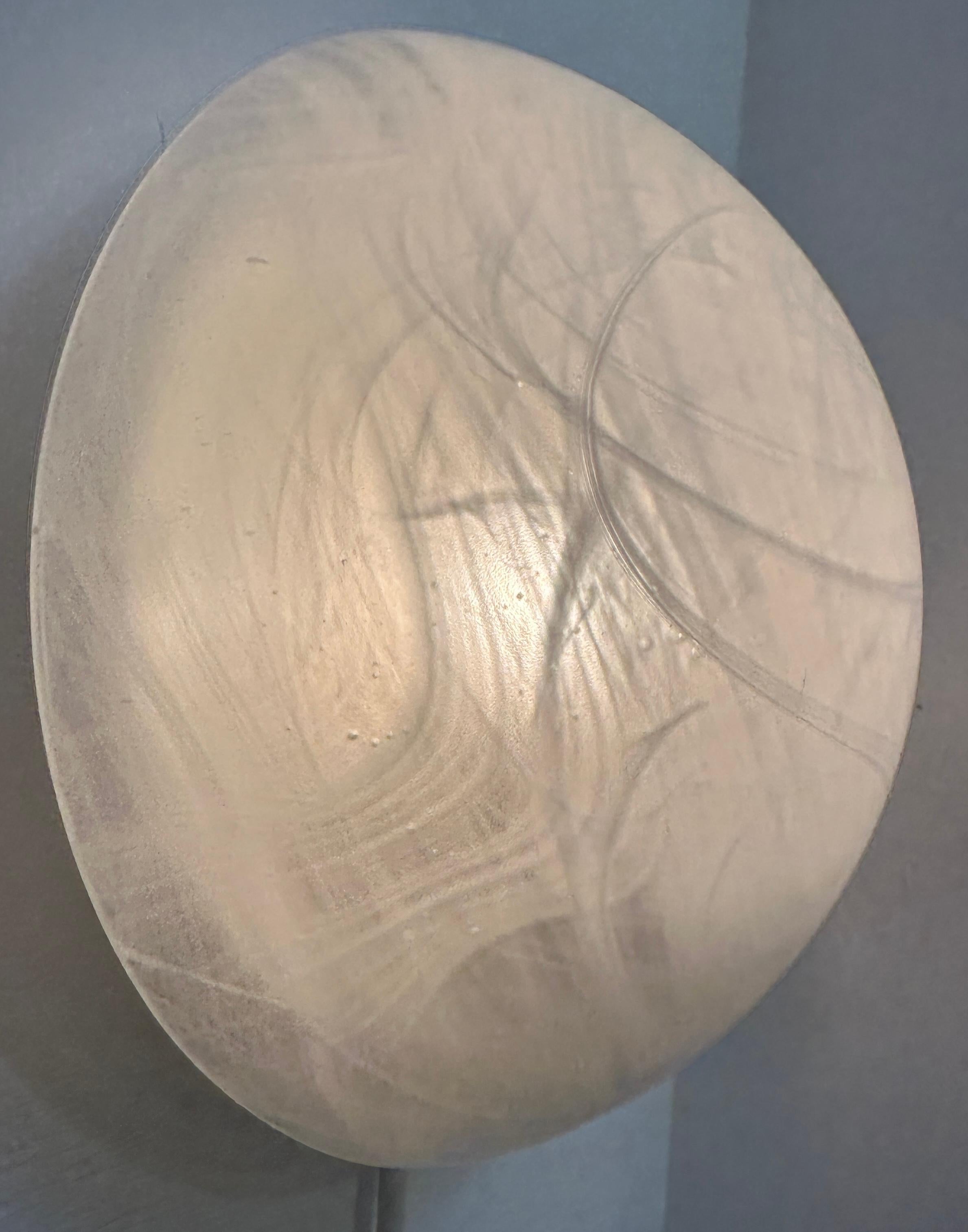 A small Mid Century Modern 1970s German Peill & Putzler domed frosted glass ceiling flush mount ceiling or wall light.  The frosted cloud-like white swirls around the grey tinted glass are similar to those around the Galaxy and the planet Saturn. 
